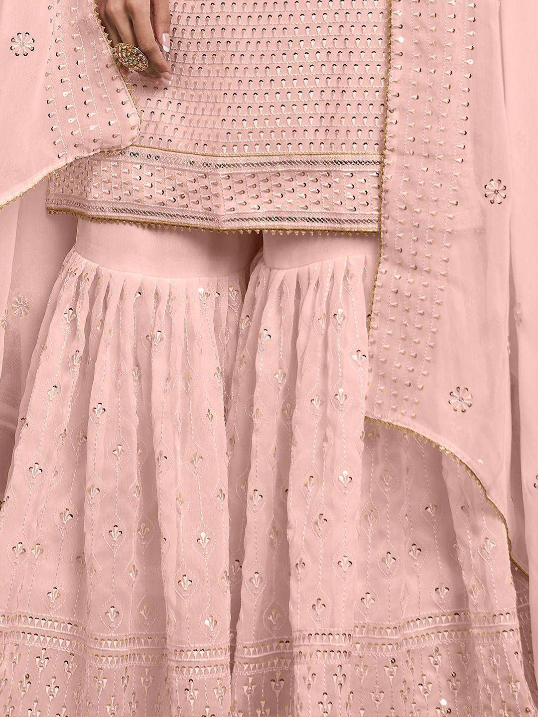 Light pink embroidered Indian ethnic wear with mirror work and gold accents