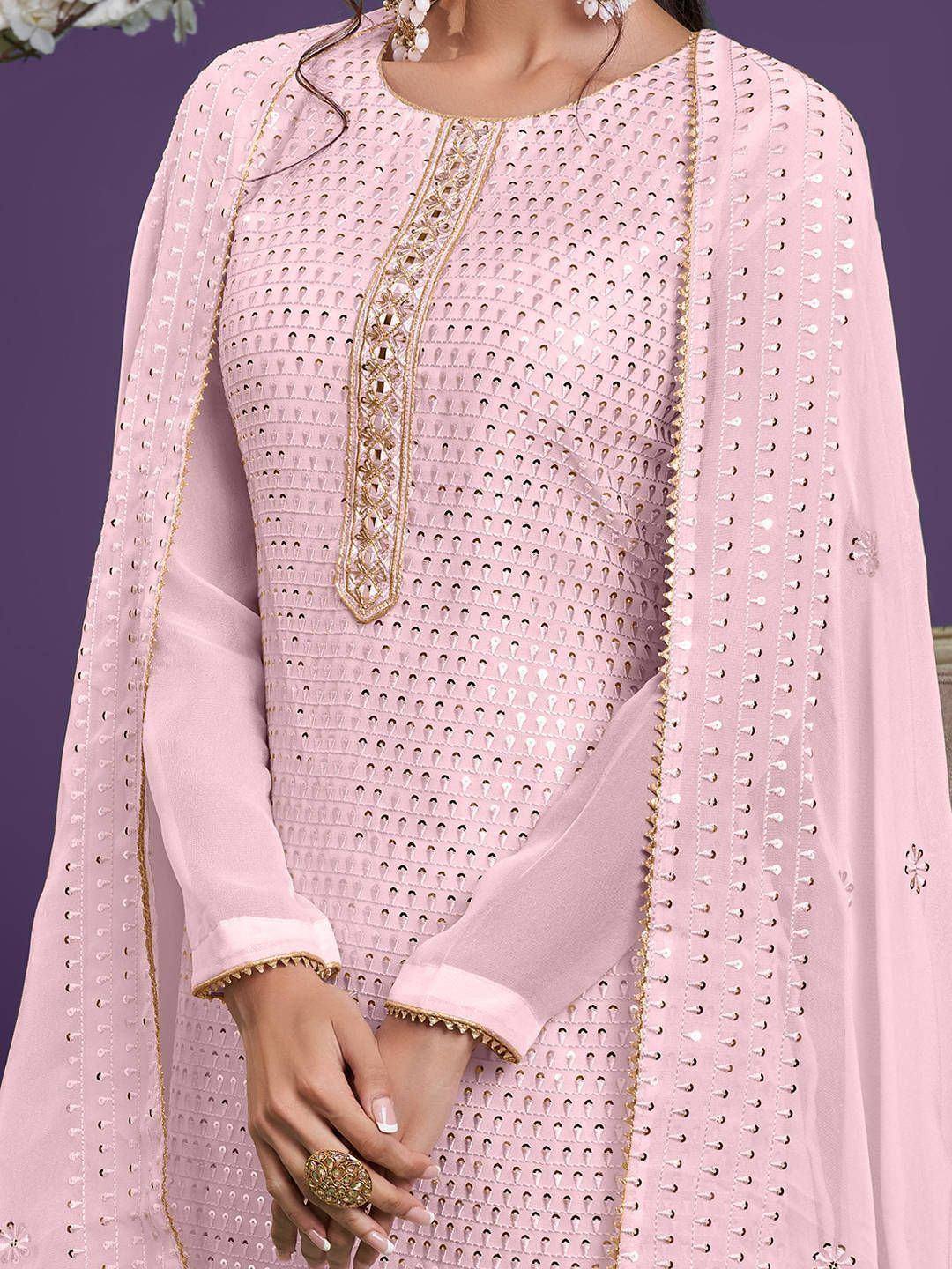 Pink embroidered salwar kameez with gold detailing and sheer dupatta, perfect for ethnic occasions