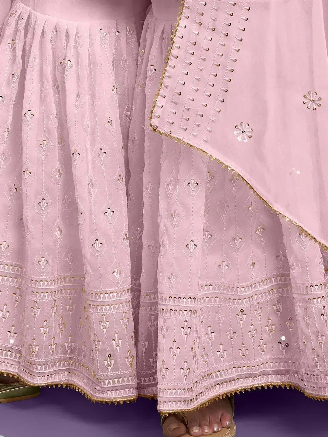 Pink embroidered lehenga choli with gold detailing and floral motifs, perfect for Indian ethnic wear