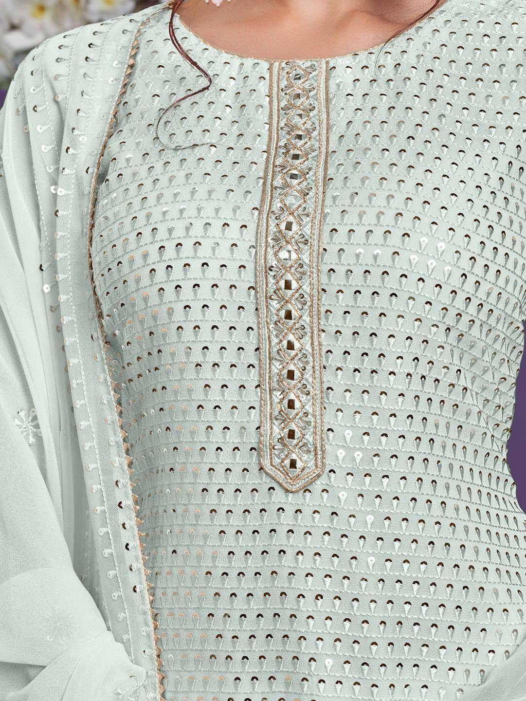 Light green ethnic kurti with intricate mirror work and gold embroidery detailing