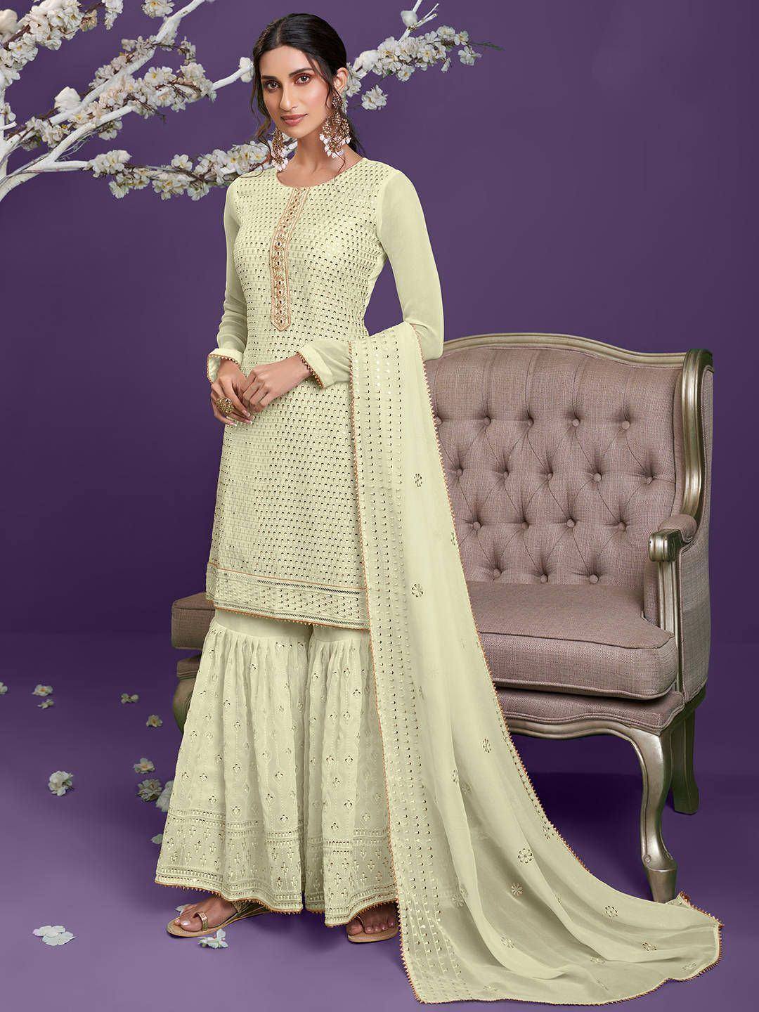 Elegant light green ethnic salwar kameez with intricate embroidery and flared pants