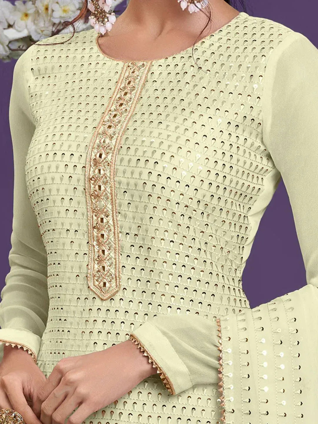 Elegant light green ethnic kurta with intricate cutwork and gold embroidery, perfect for festive occasions.