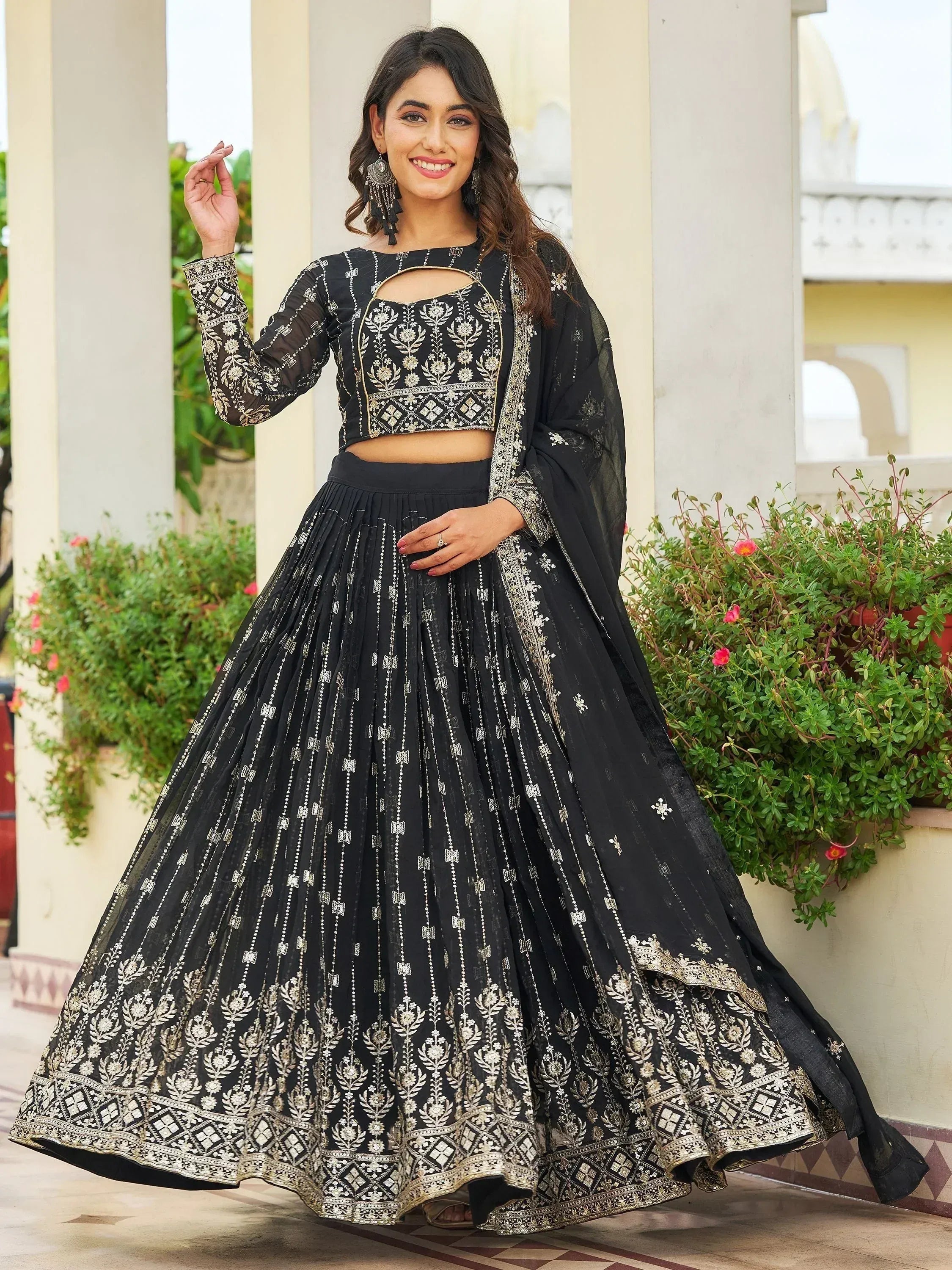 Black embroidered lehenga choli with gold detailing, perfect for Indian ethnic wear
