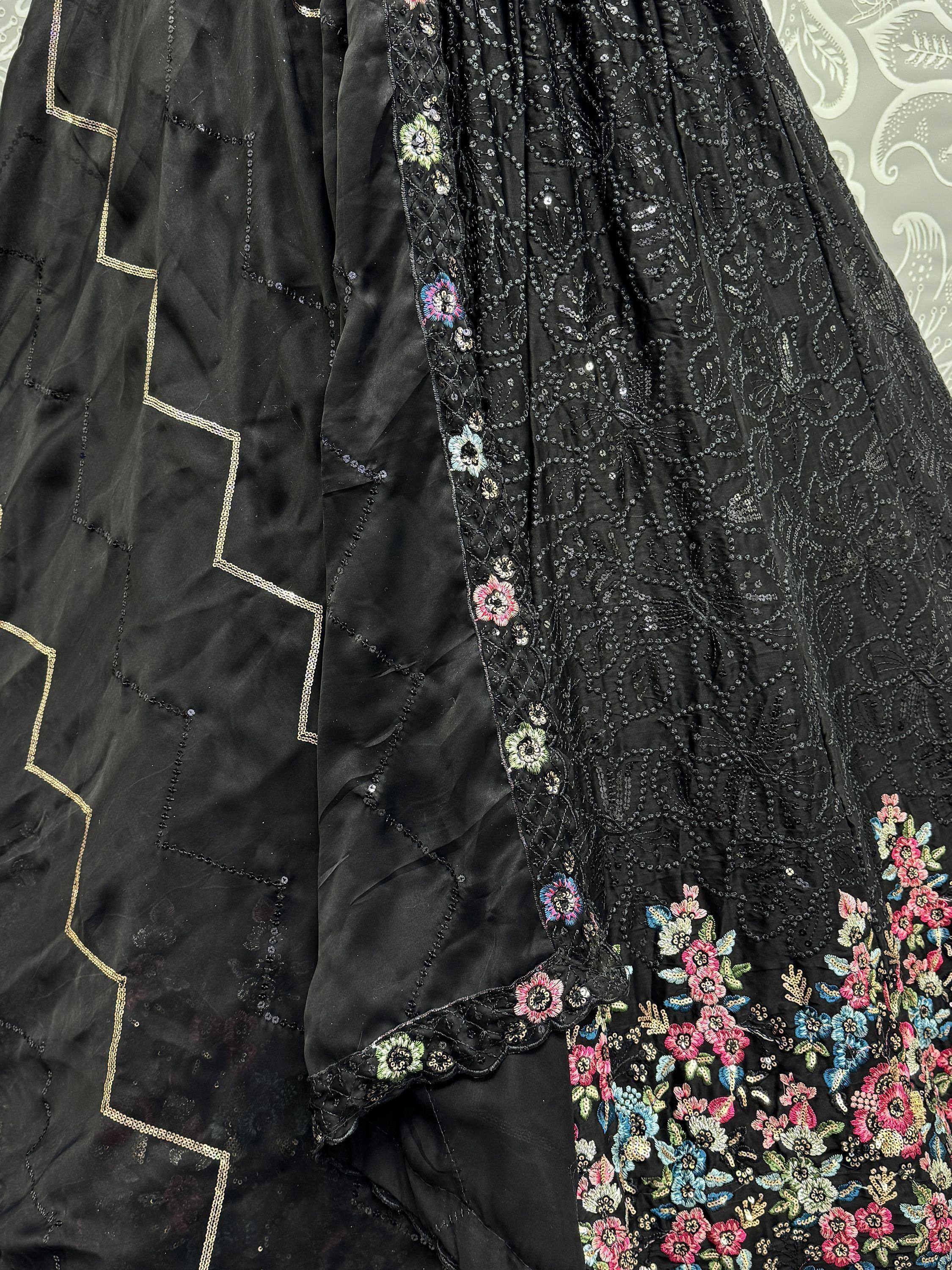 Black ethnic gown with floral embroidery and sequin detailing, perfect for Indian festive wear