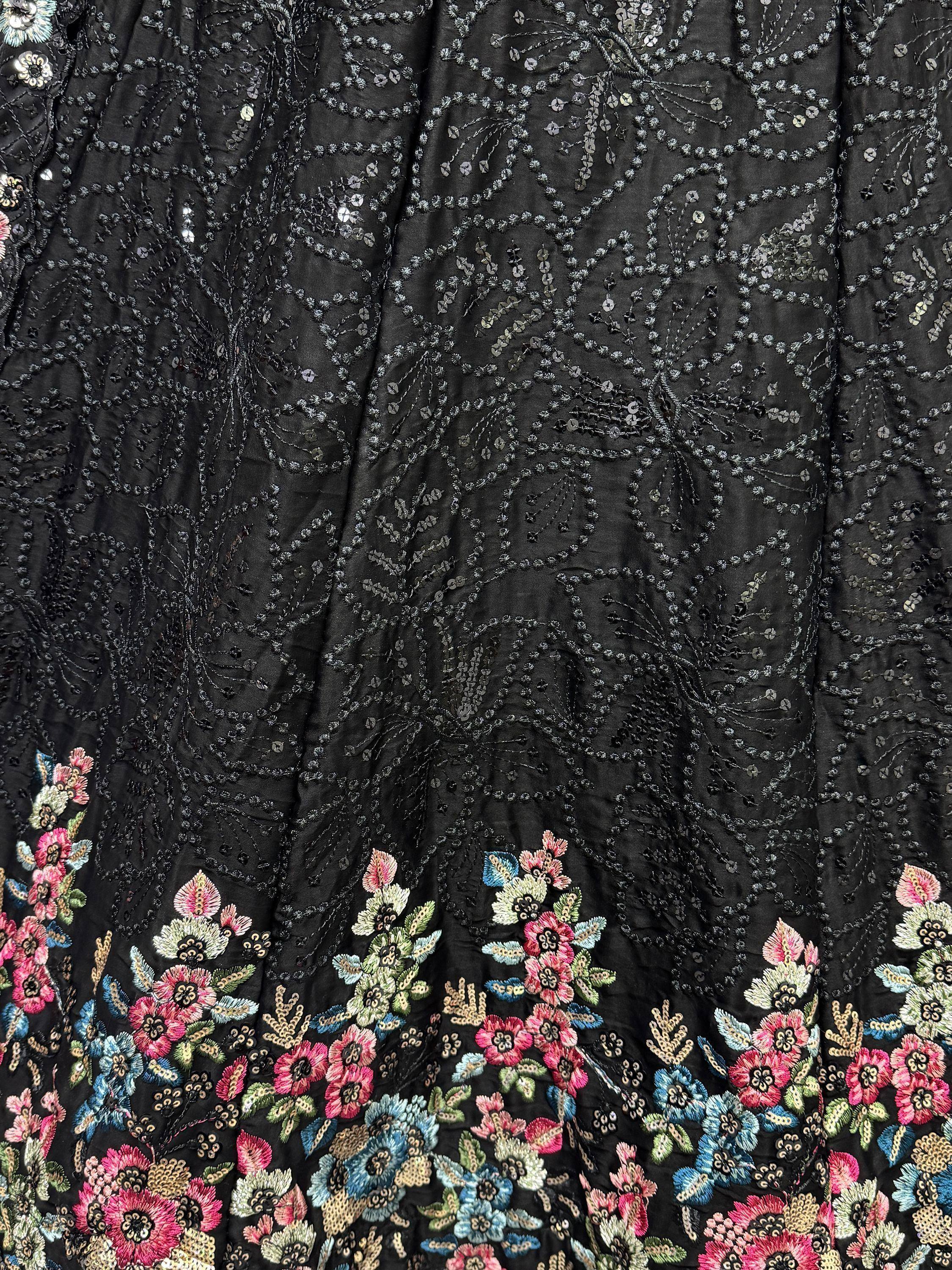 Black ethnic gown with floral embroidery and sequin detailing for festive occasions