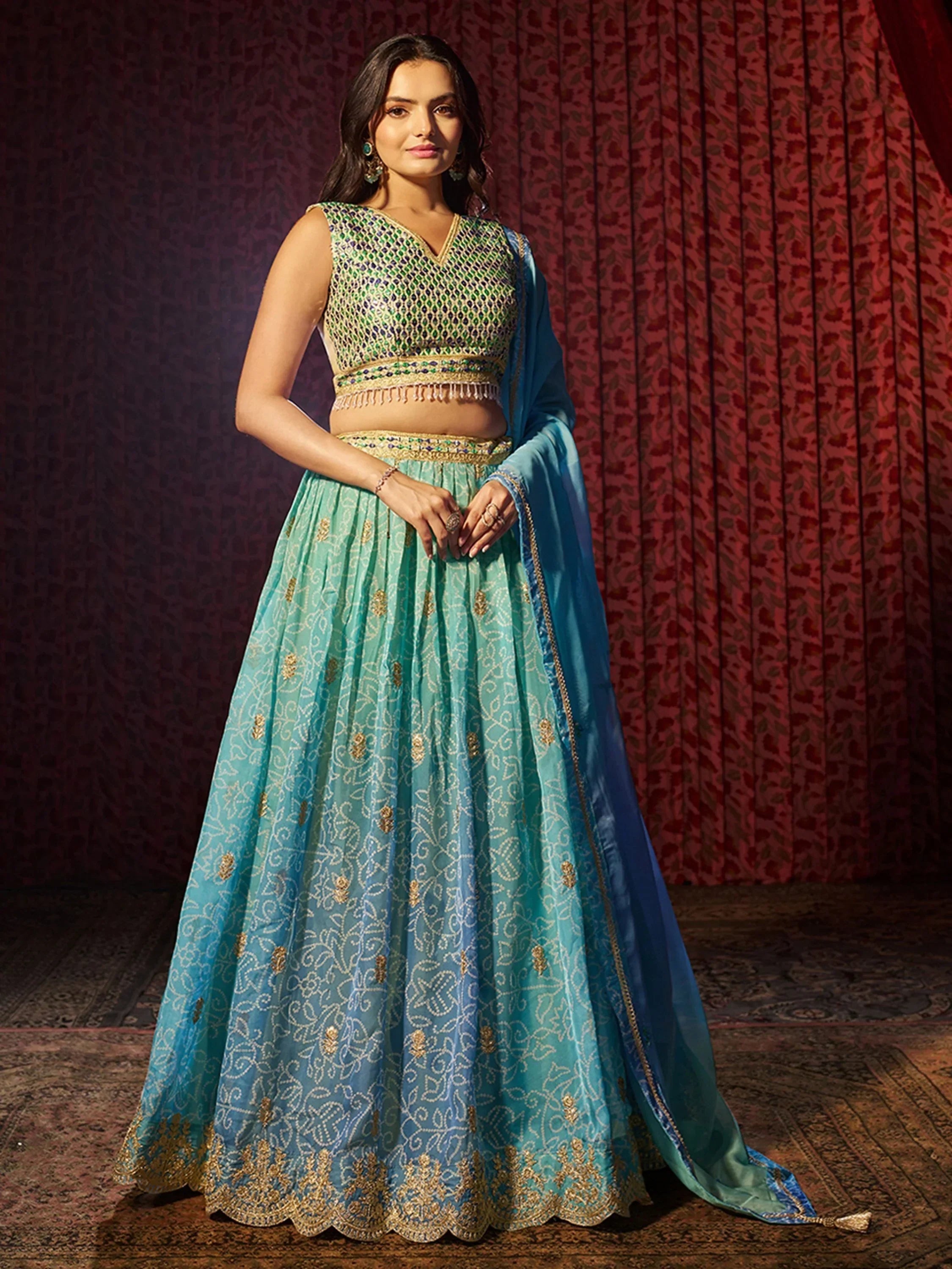 Elegant turquoise lehenga choli with gold embroidery and matching dupatta for Indian ethnic wear
