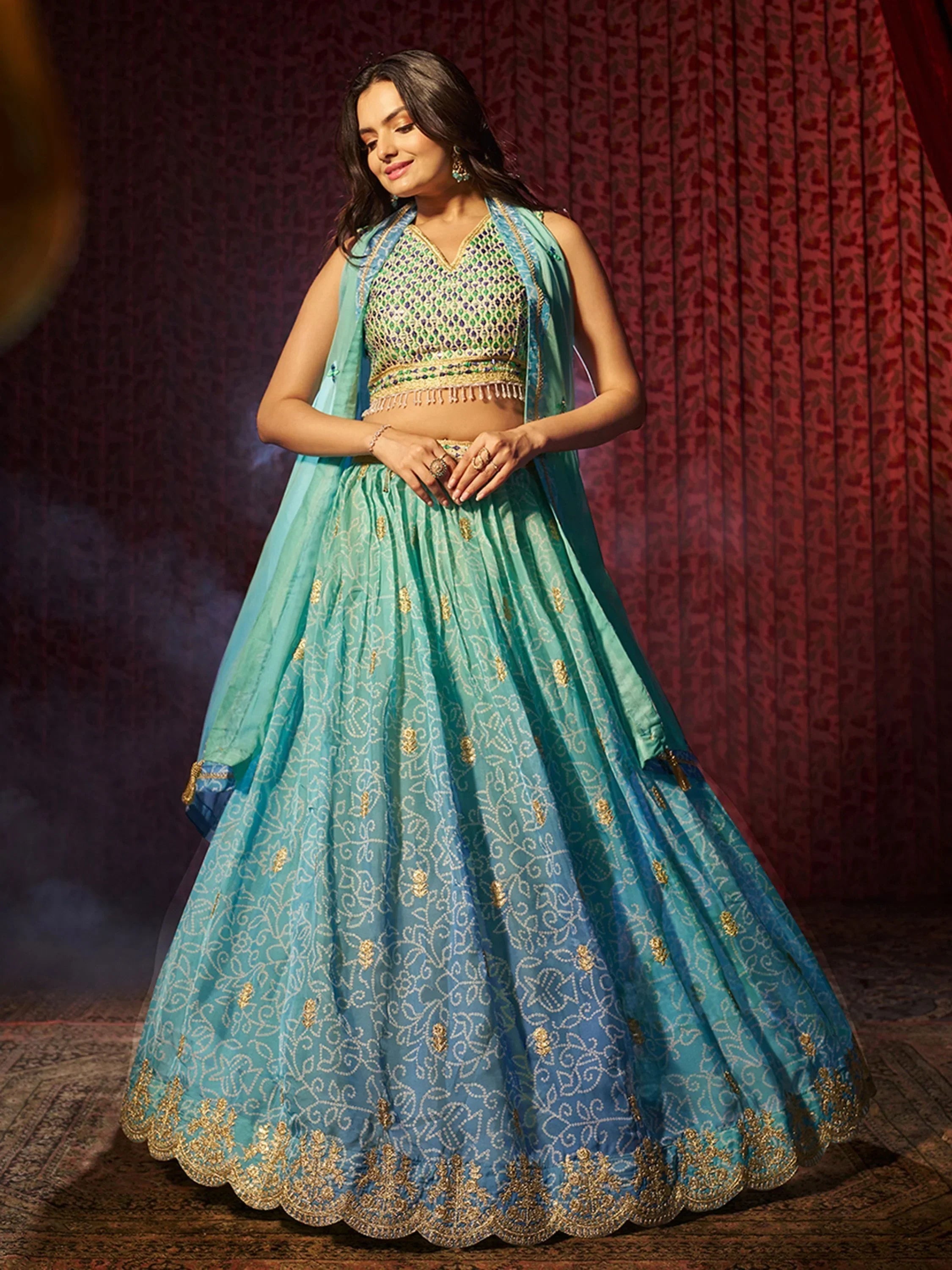 Turquoise designer lehenga choli with gold embroidery, perfect for Indian ethnic wear occasions