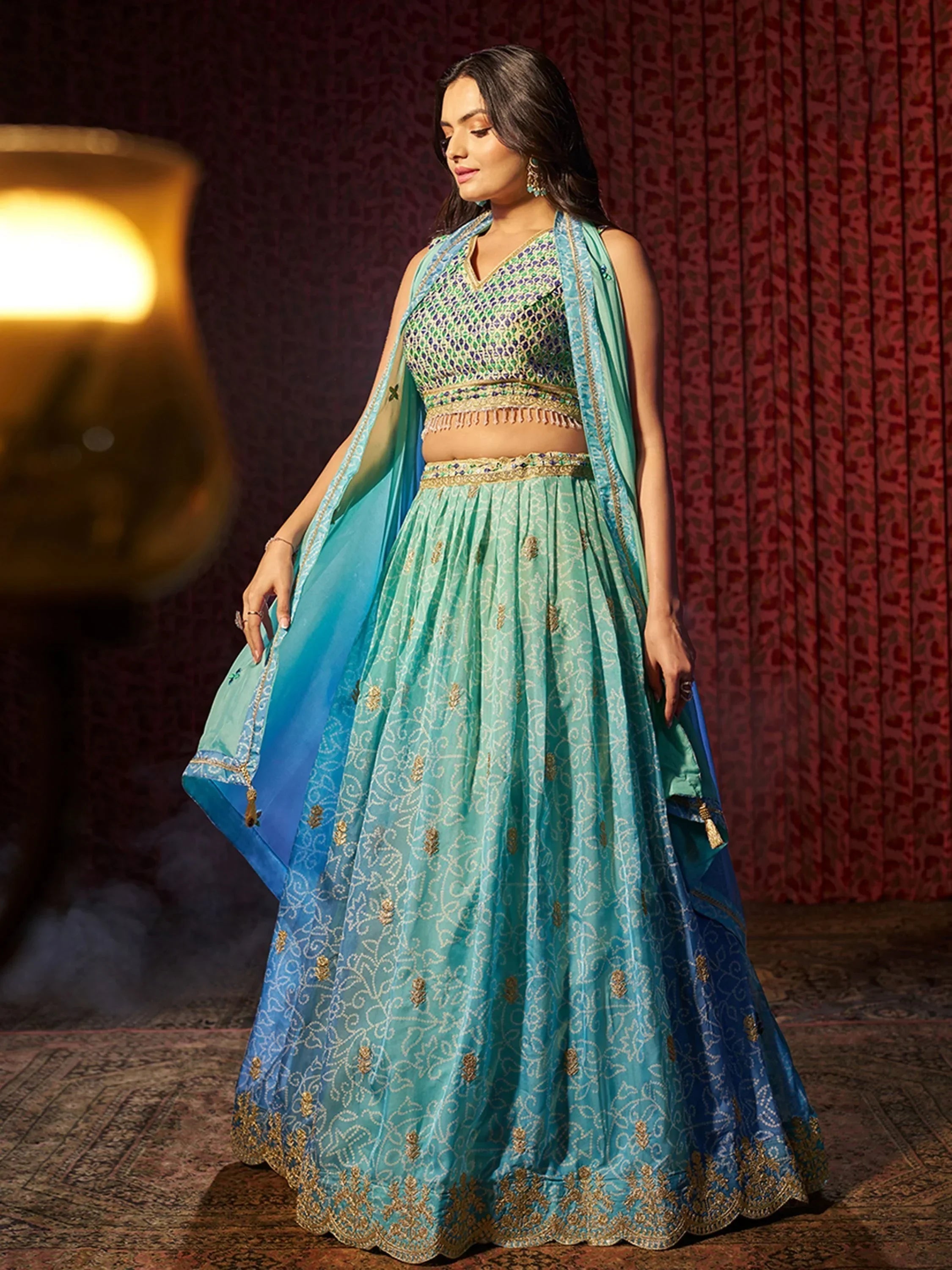 Blue green embroidered lehenga choli with gold detailing, perfect for Indian ethnic wear events