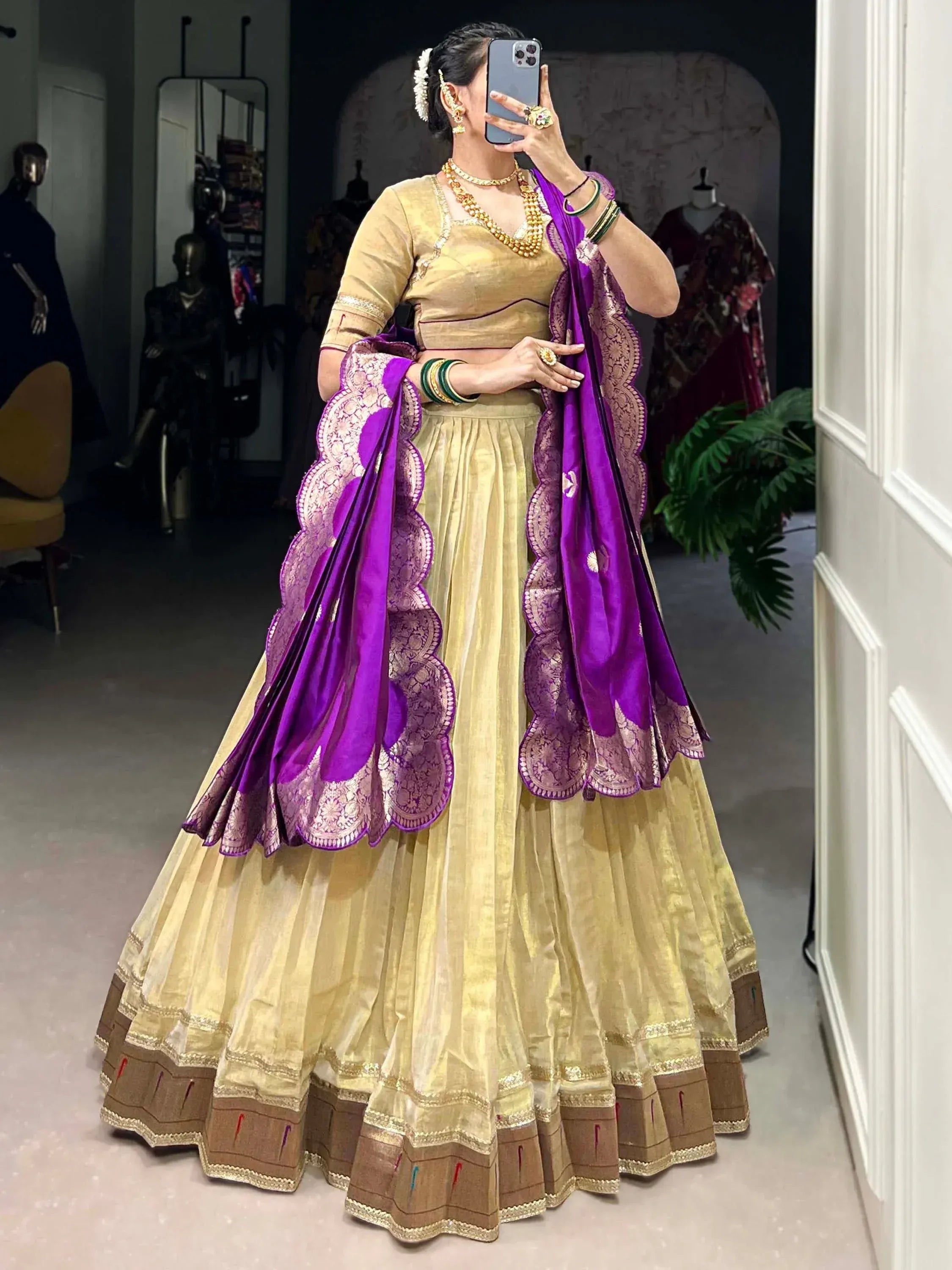 Gold lehenga choli with purple dupatta, traditional Indian ethnic wear for weddings and festivals