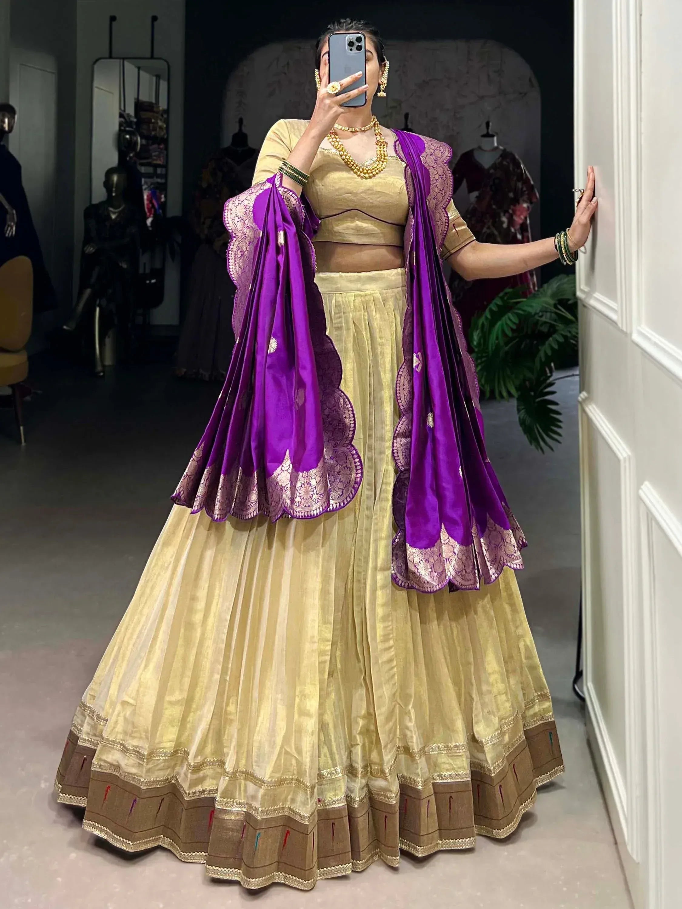 Golden lehenga choli with purple dupatta, ethnic Indian wear for weddings and festivals