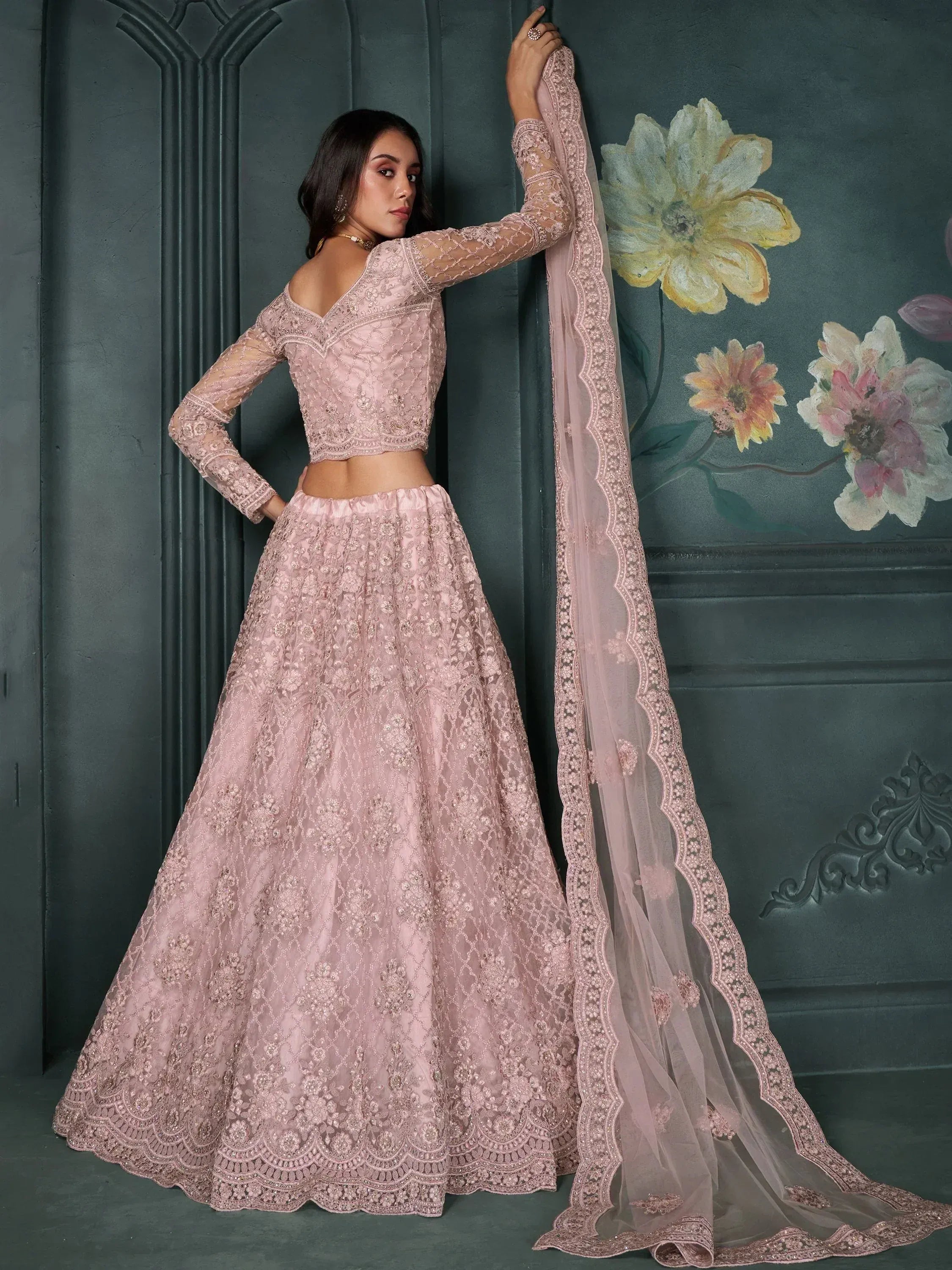 Pink embroidered lehenga choli with sheer dupatta, perfect for Indian weddings and festive occasions