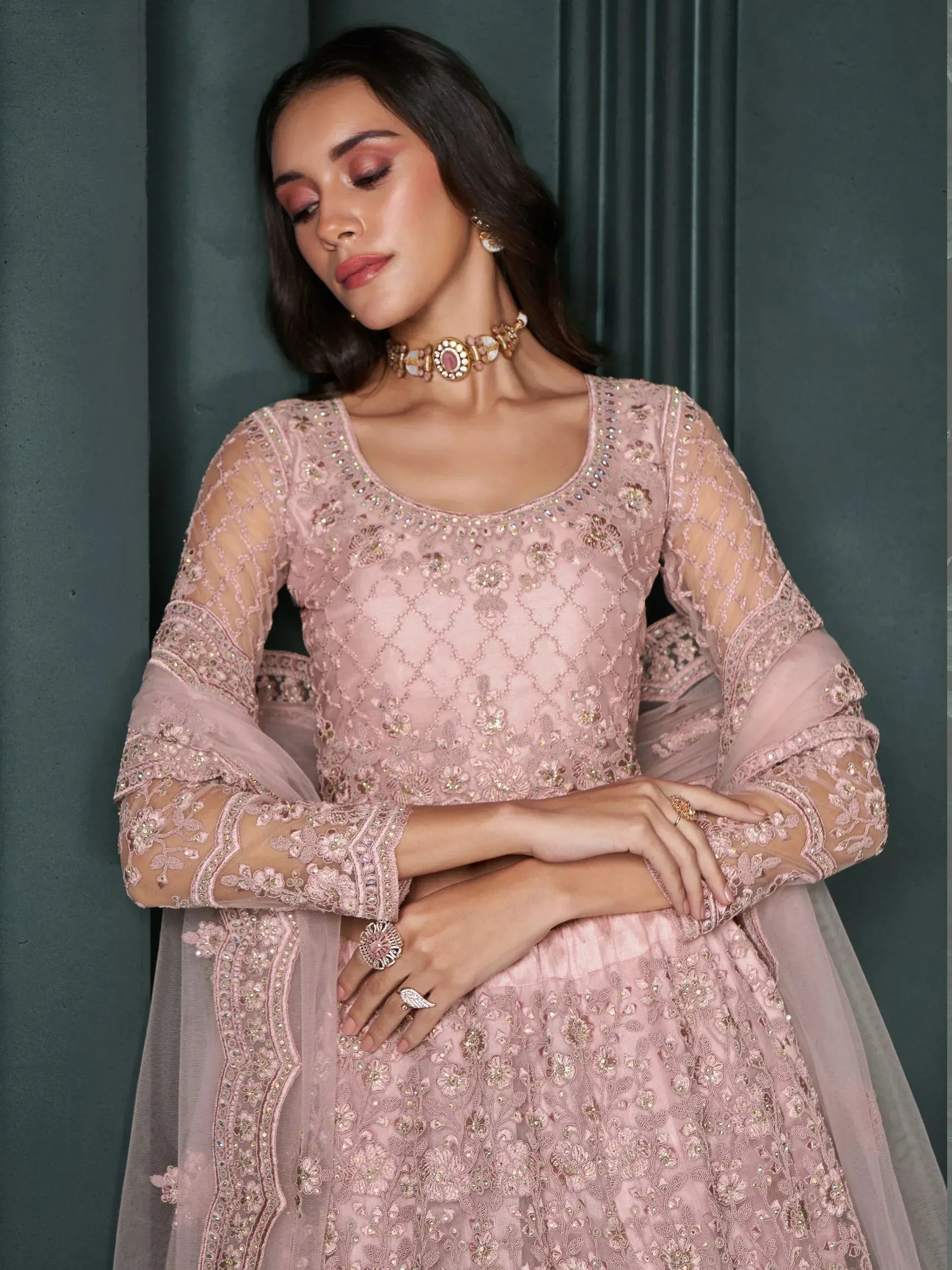 Pink embroidered designer lehenga choli with sheer sleeves and floral embellishments