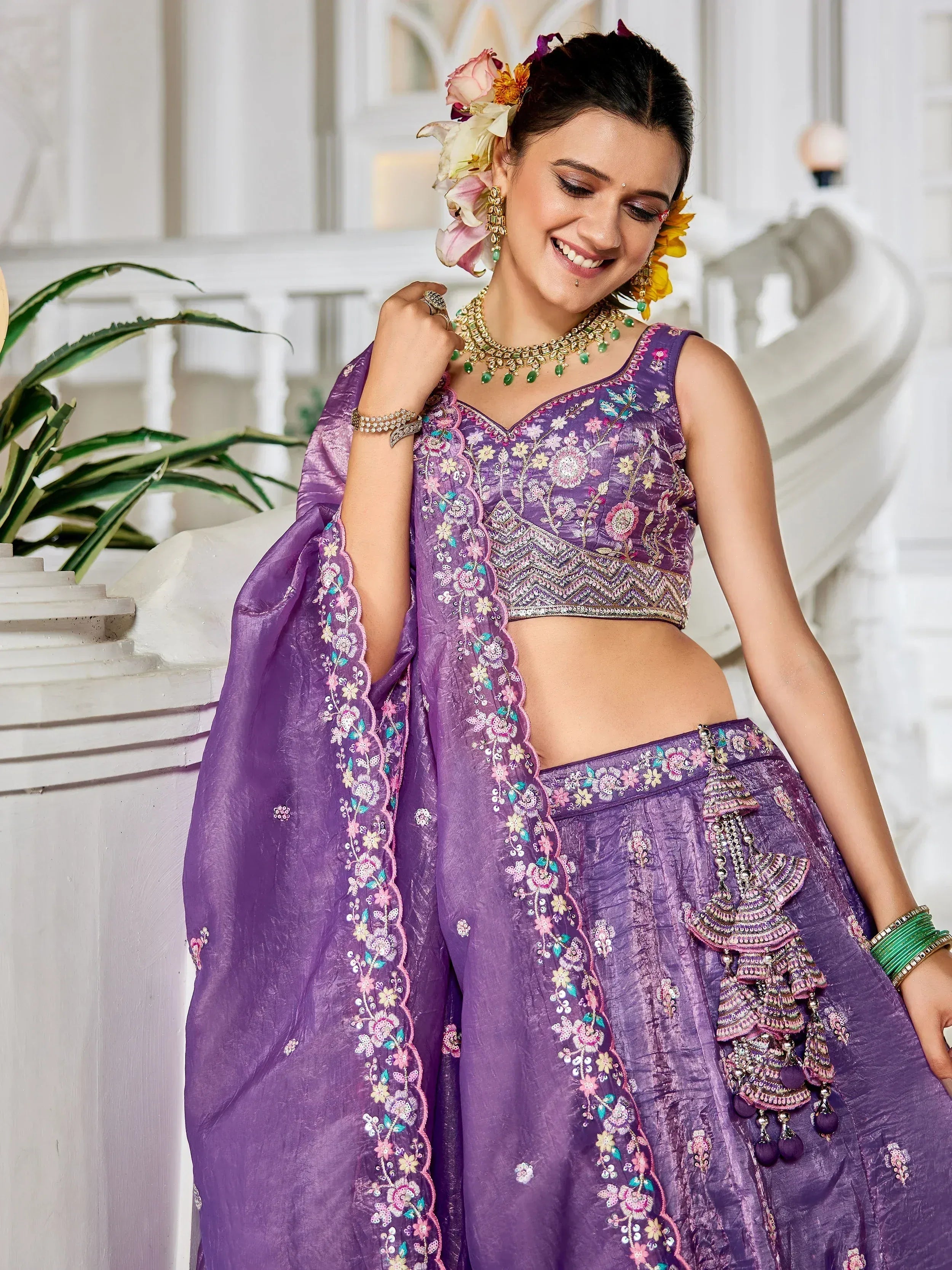 Purple embroidered lehenga choli with floral detailing, perfect for Indian ethnic wear occasions.