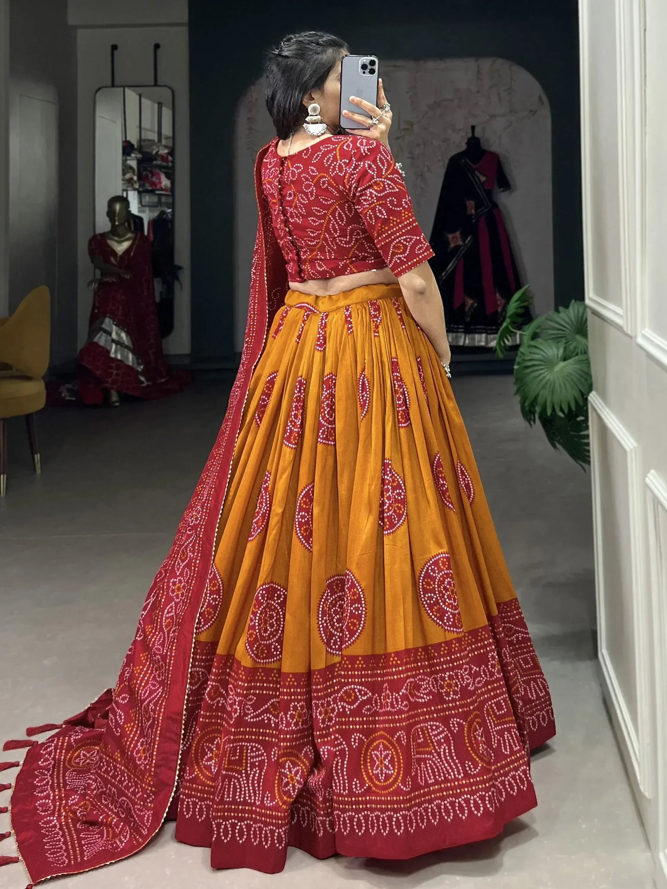 Red and mustard Bandhani lehenga choli with mirror work, ethnic Indian wear for women