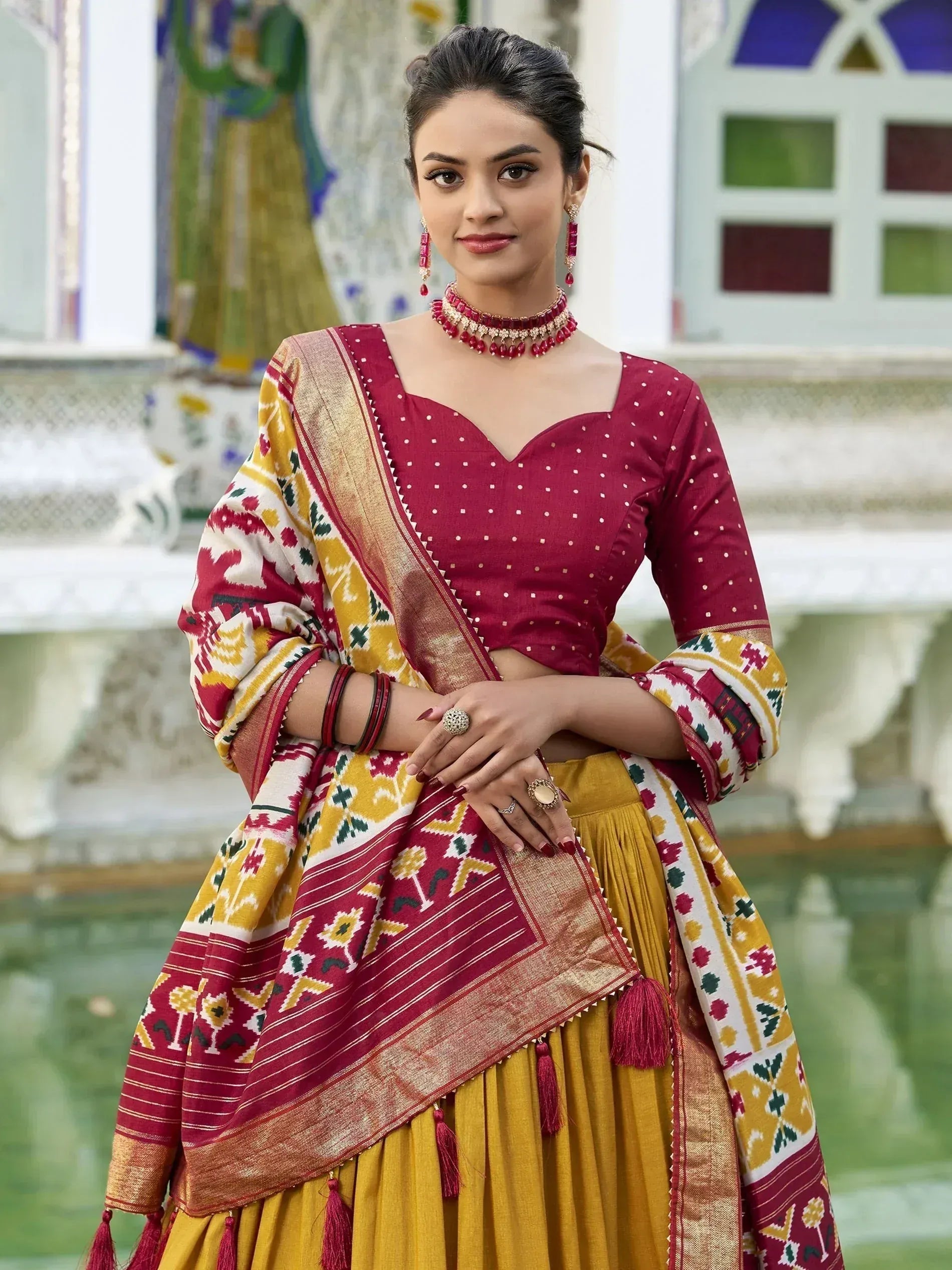 Maroon and mustard Indian ethnic lehenga choli with ikat dupatta, perfect for festive occasions