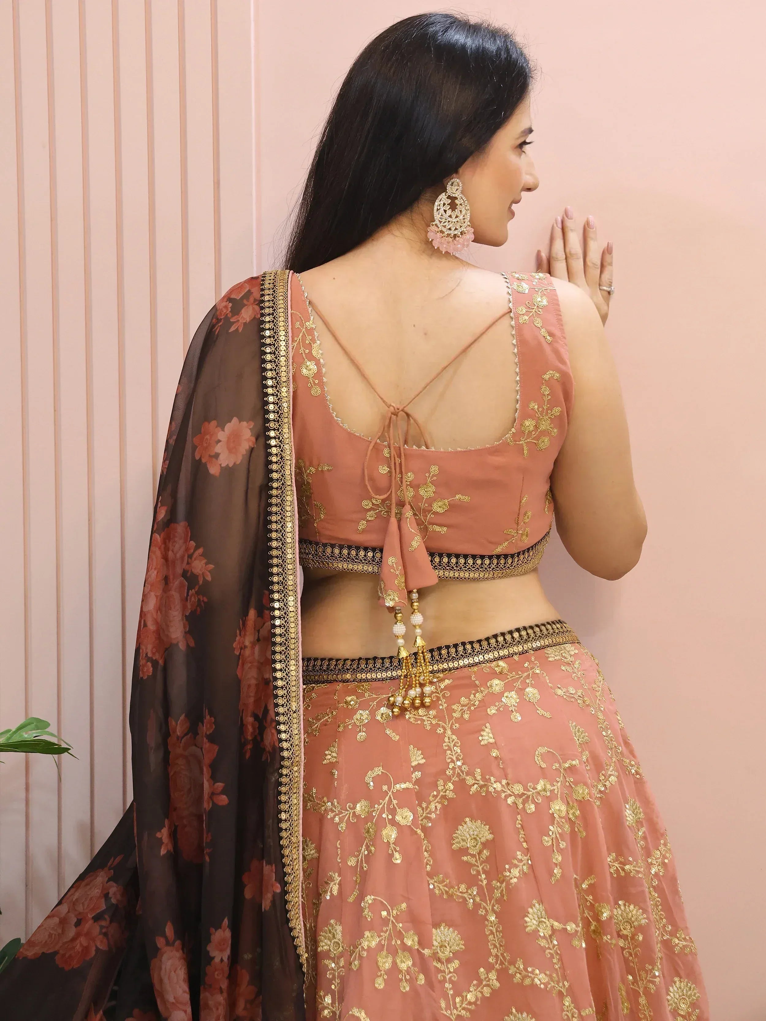 Peach lehenga choli with gold embroidery, floral dupatta, and back tie blouse for Indian ethnic wear