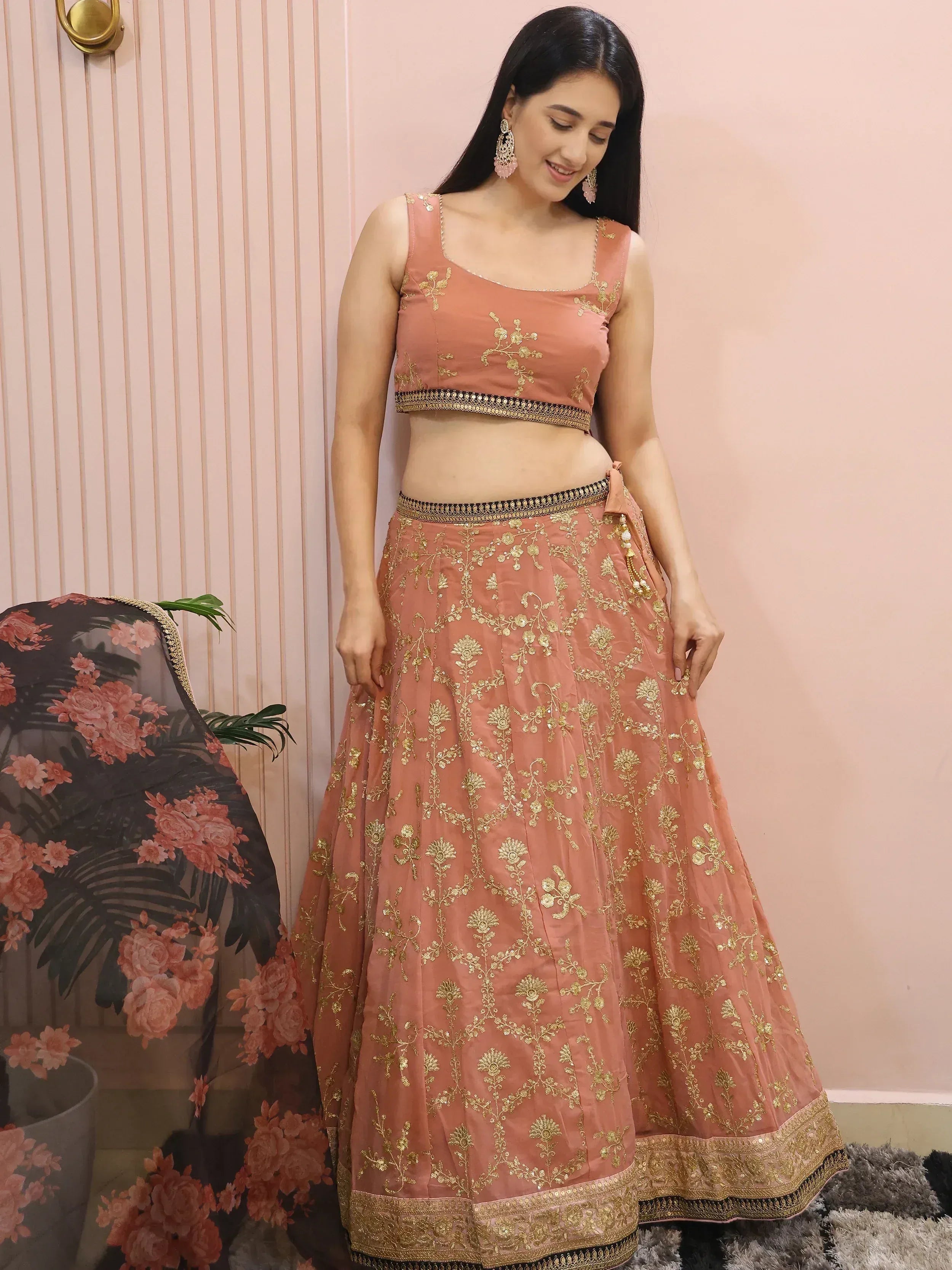 Dusty pink lehenga choli with gold floral embroidery, perfect for Indian ethnic wear occasions.