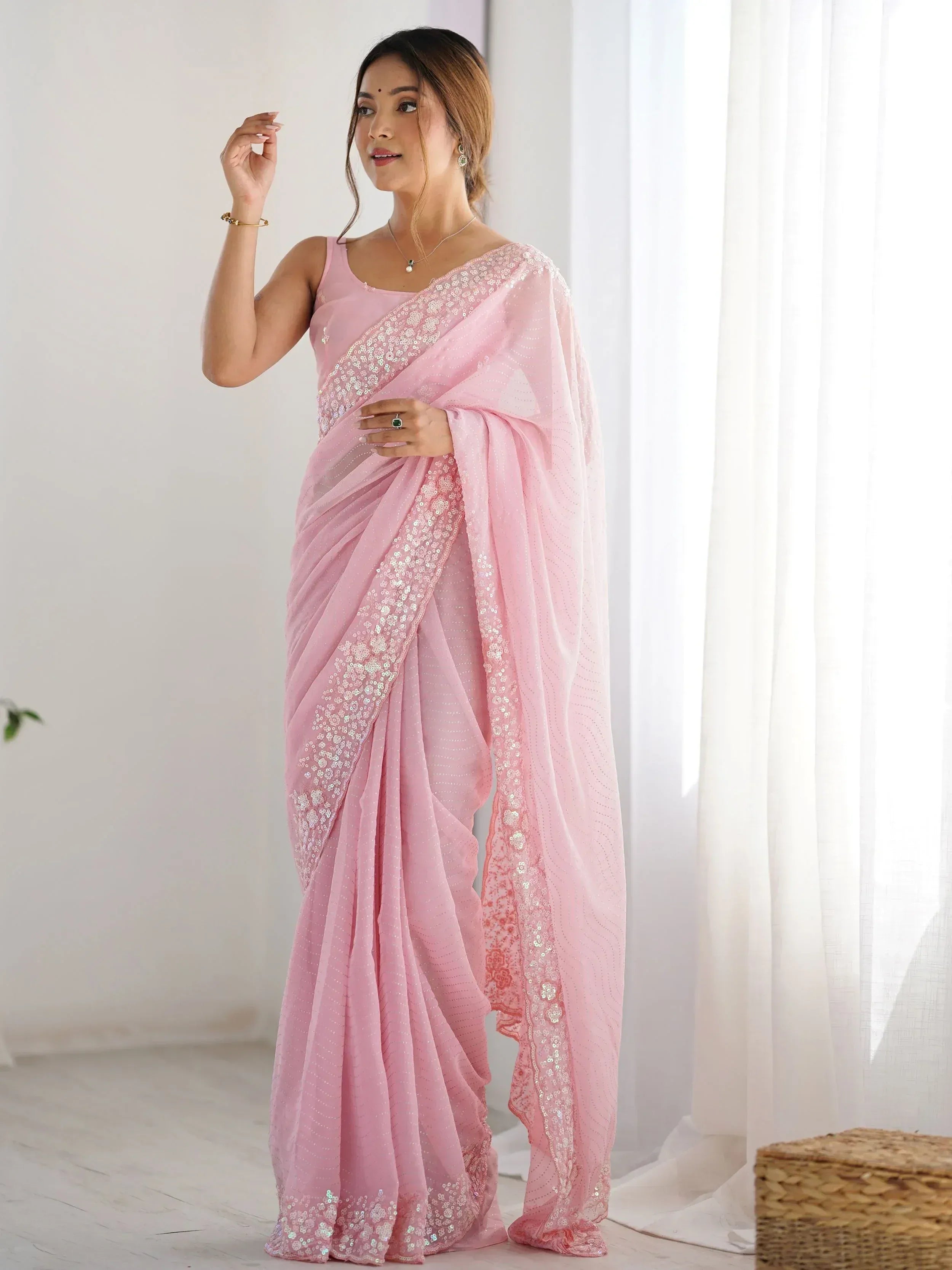 Pink sequin saree with floral embroidery, perfect for Indian ethnic wear and festive occasions.