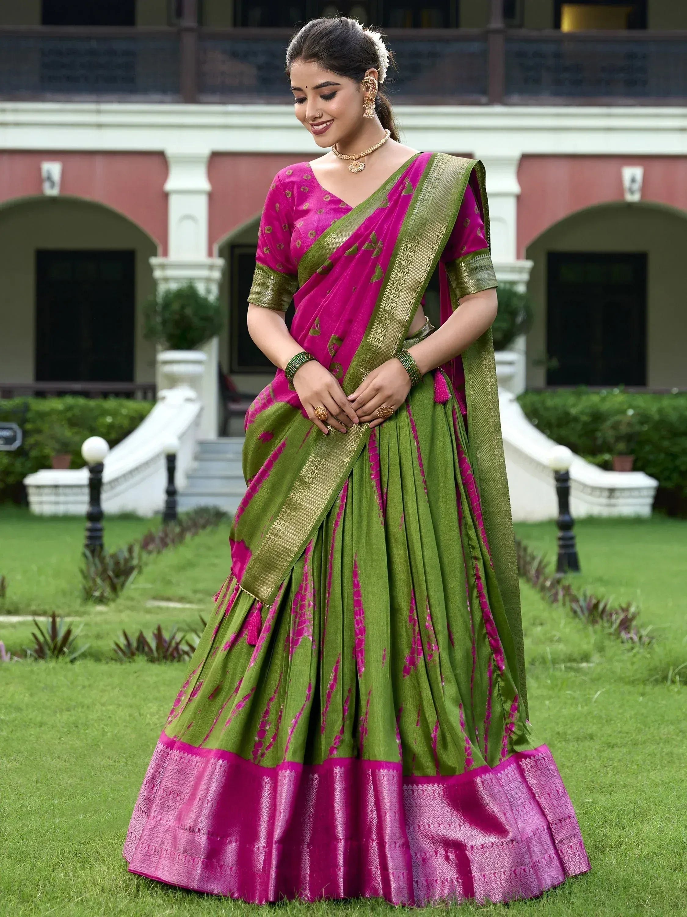 Pink and green designer lehenga choli with gold border, perfect for Indian ethnic wear occasions