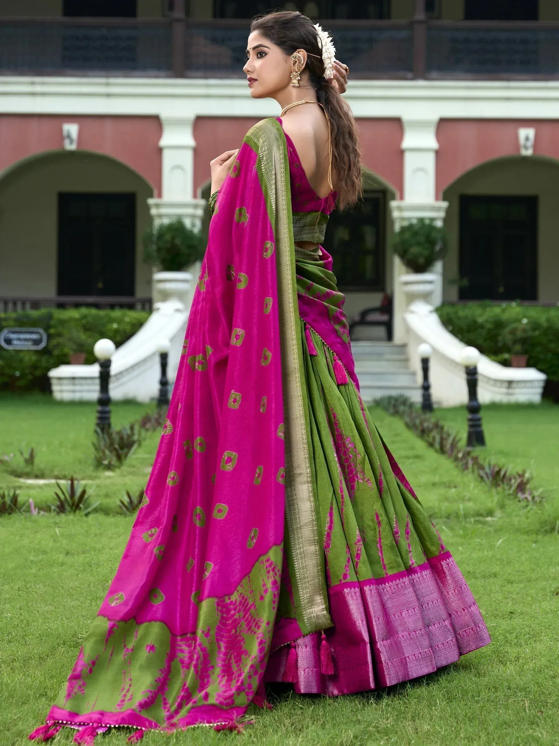Pink and green designer saree with gold motifs, perfect for Indian ethnic wear occasions