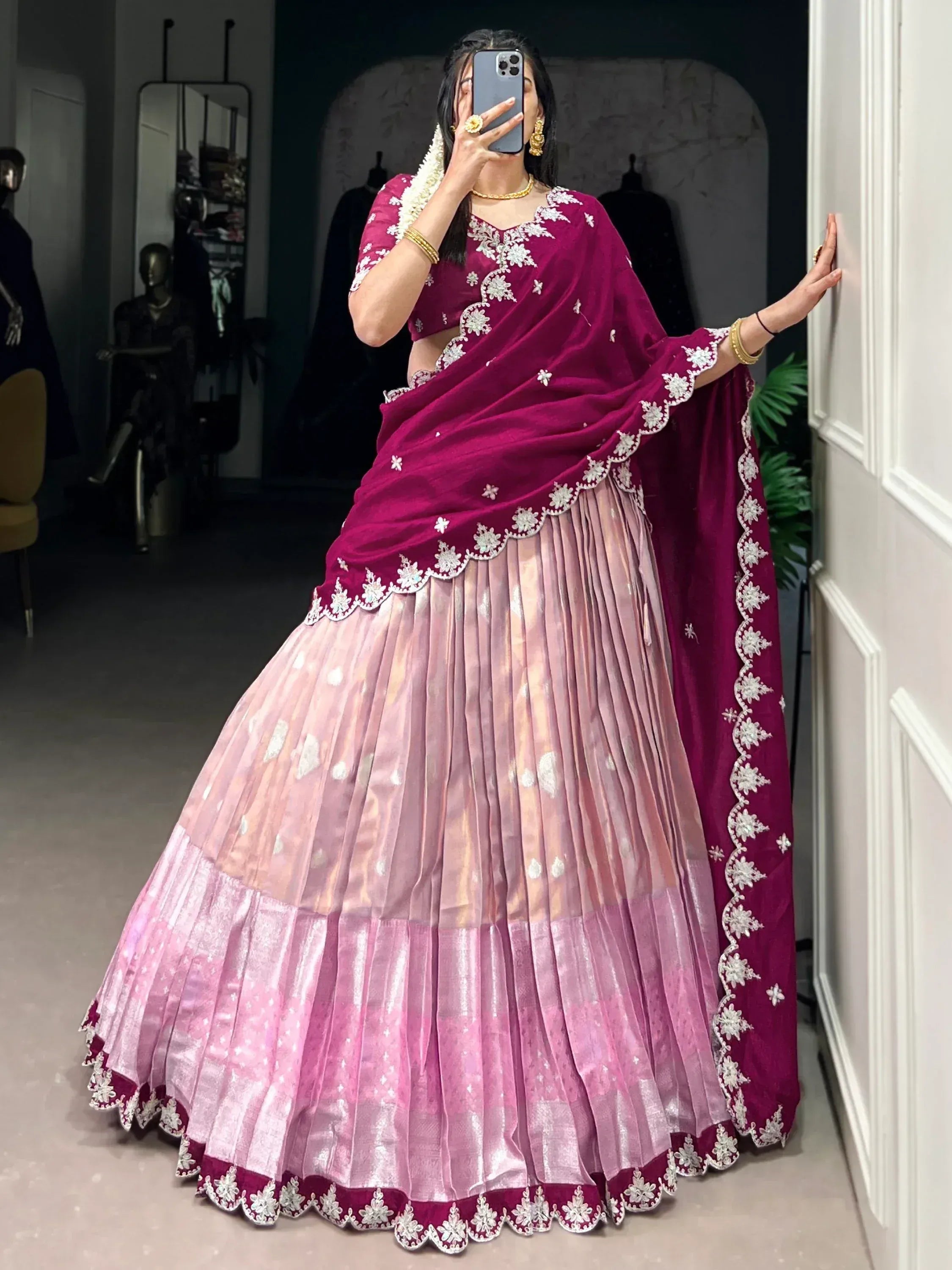 Elegant maroon and pink lehenga choli with floral embroidery, perfect for Indian ethnic occasions.