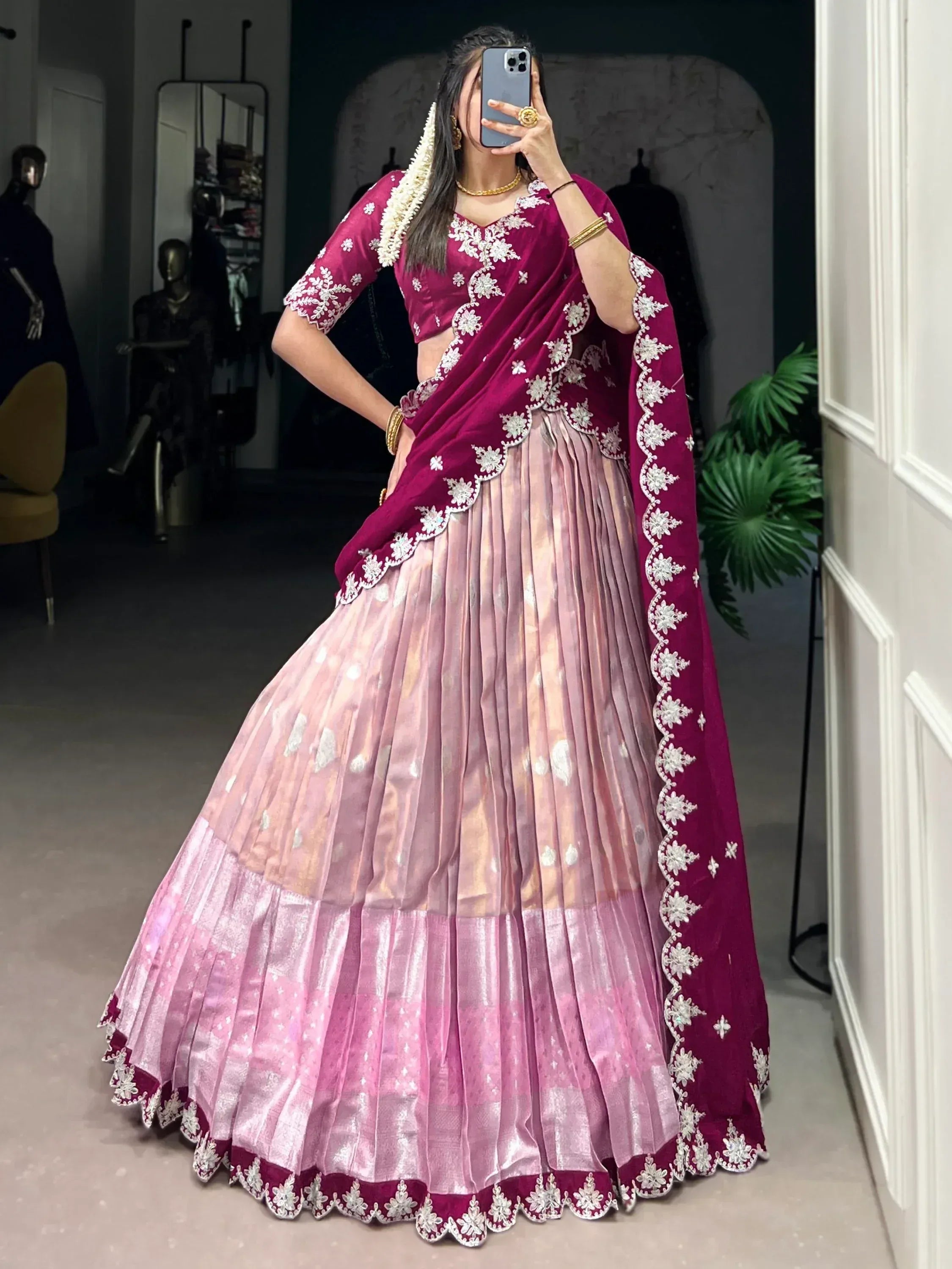 Elegant maroon and pink lehenga choli with white floral embroidery, perfect for Indian ethnic wear occasions.