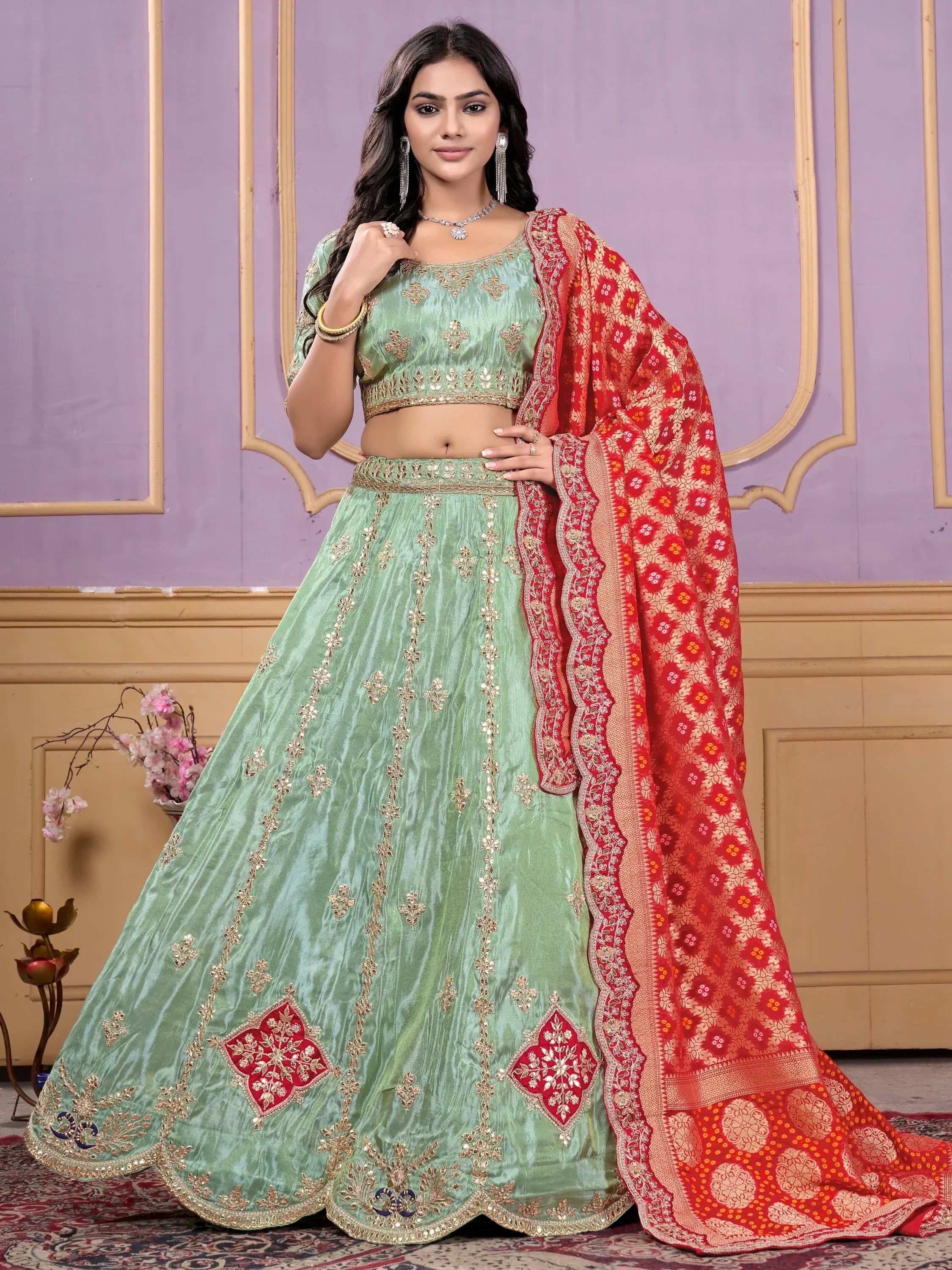 Mint green designer lehenga choli with red dupatta, perfect for Indian ethnic wear occasions