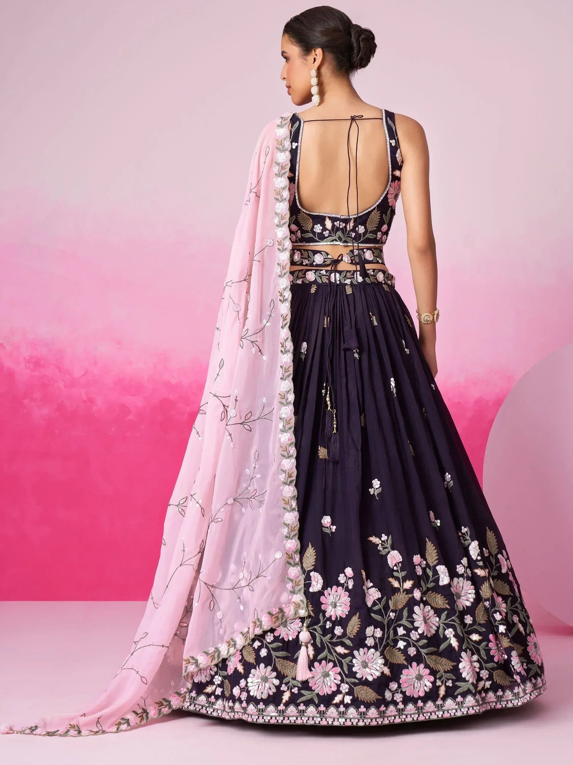 Navy blue floral embroidered lehenga choli with pink dupatta, back view