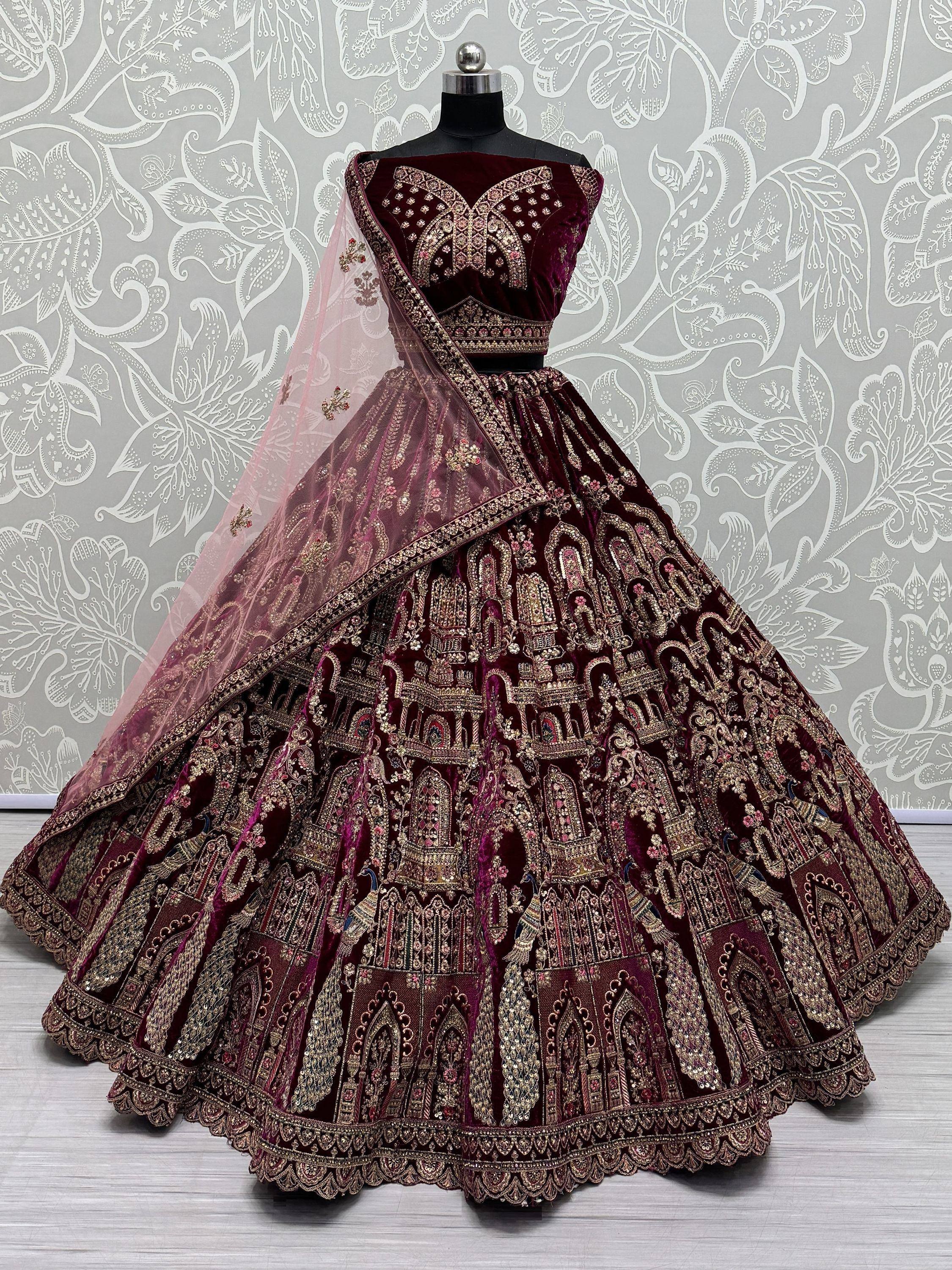 Burgundy velvet designer lehenga choli with heavy gold embroidery and sheer dupatta, Indian ethnic wear