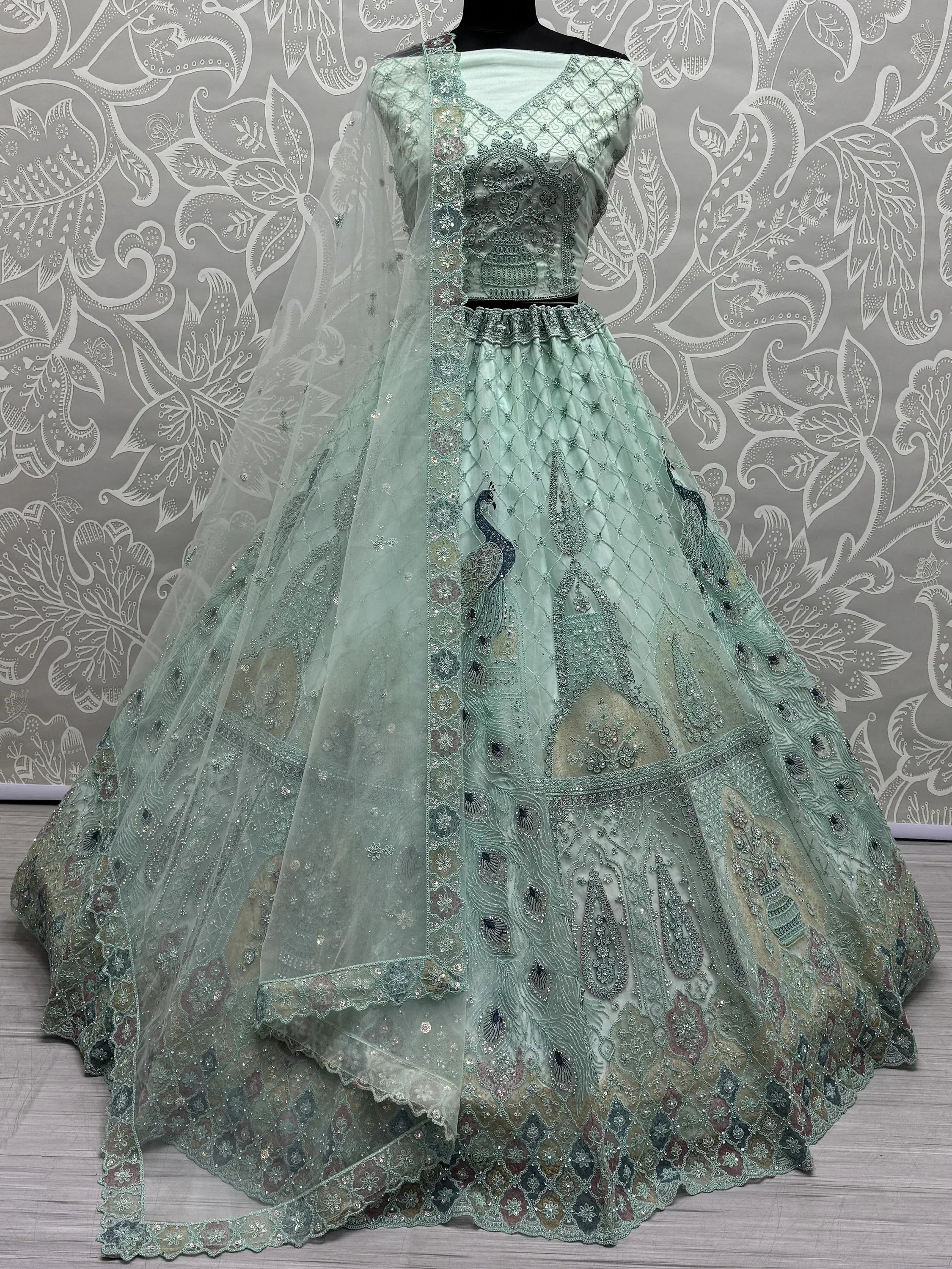 Mint green designer lehenga choli with peacock embroidery and net dupatta, ethnic Indian wear