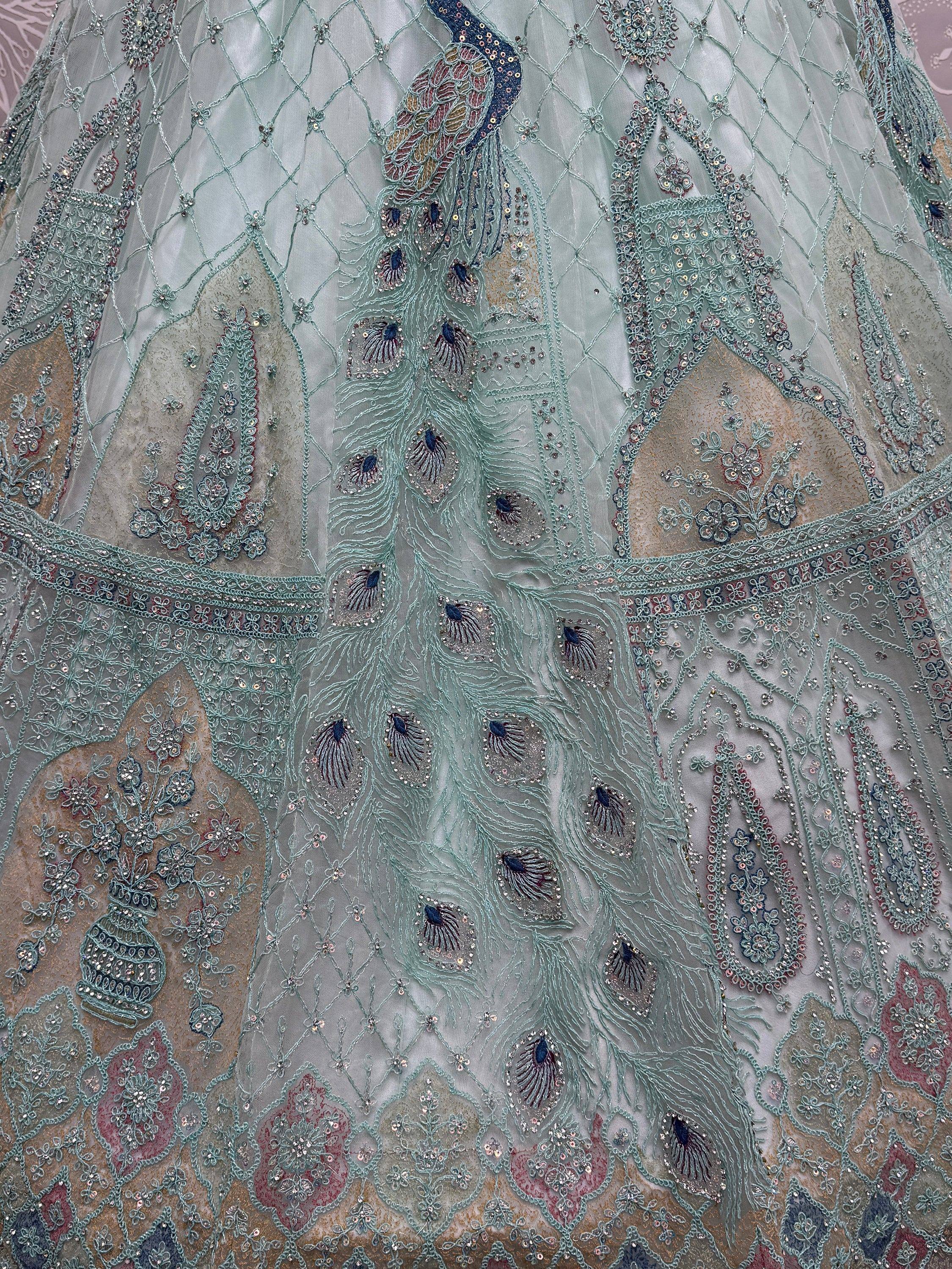 Peacock-embroidered ethnic gown with intricate sequin and threadwork detailing