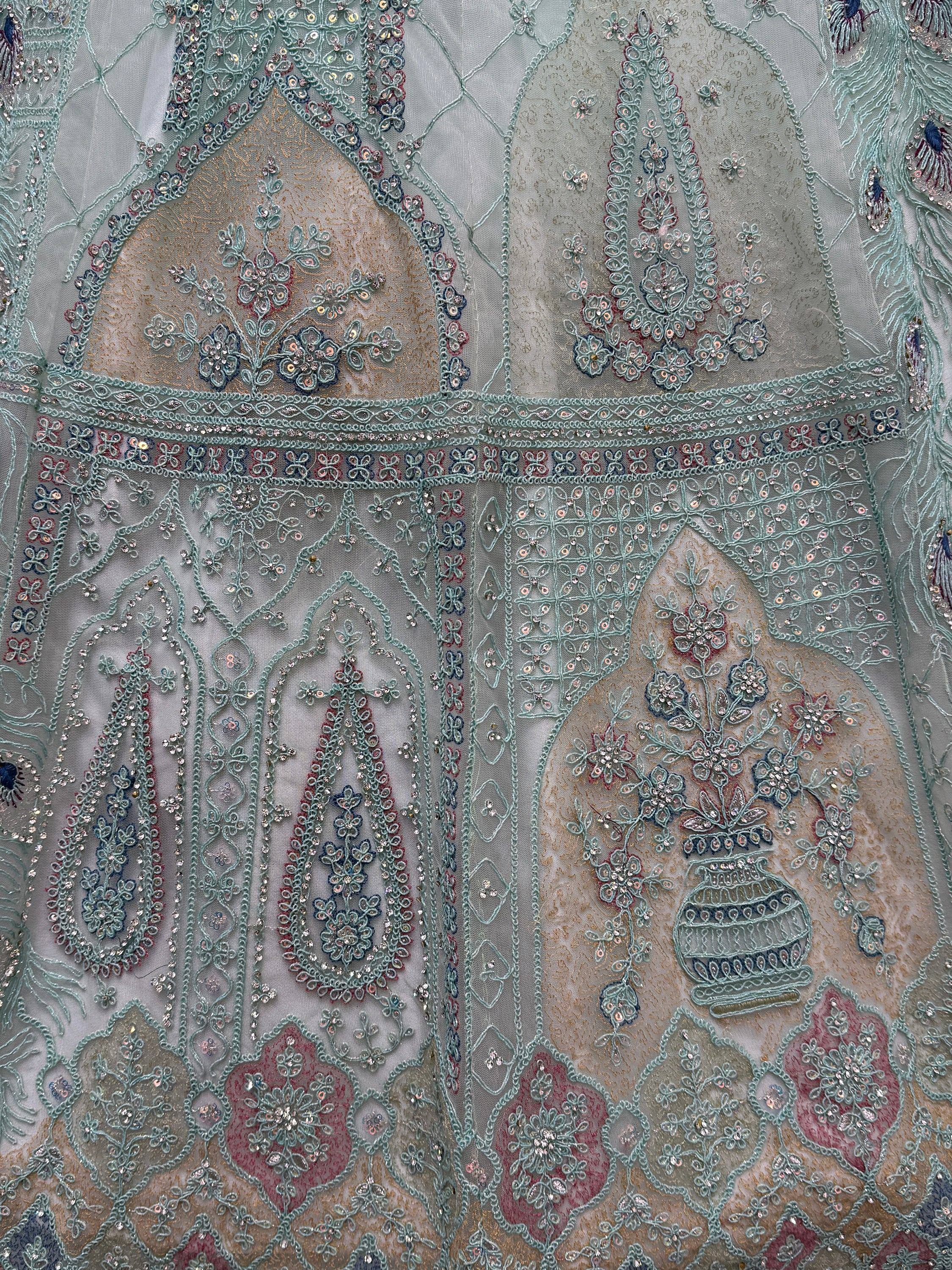 Exquisite Indian ethnic wear with intricate floral embroidery, sequins, and pastel hues for festive occasions.
