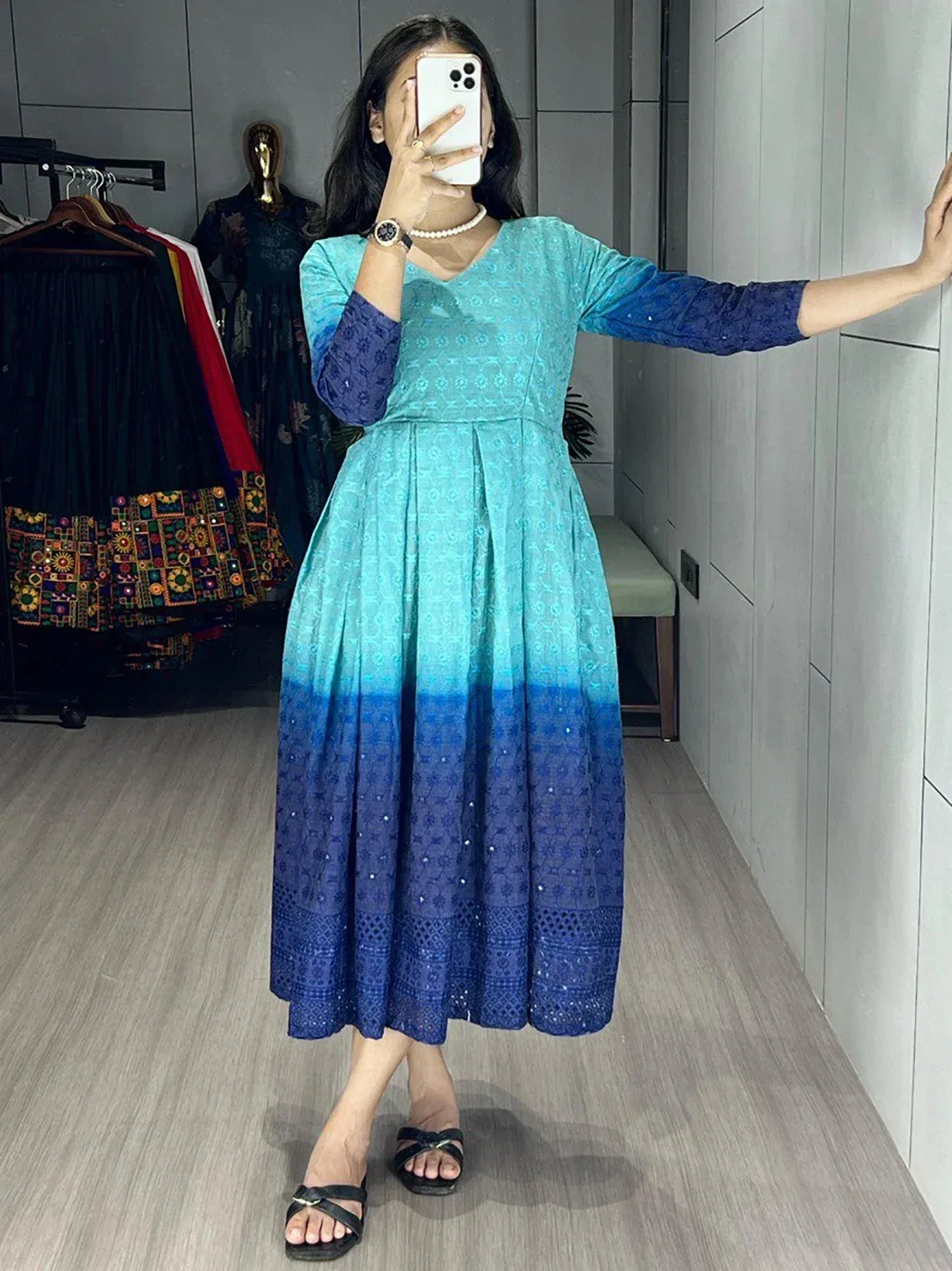 Woman wearing blue ombre ethnic gown with lace detailing, perfect for Indian occasions and festive wear.