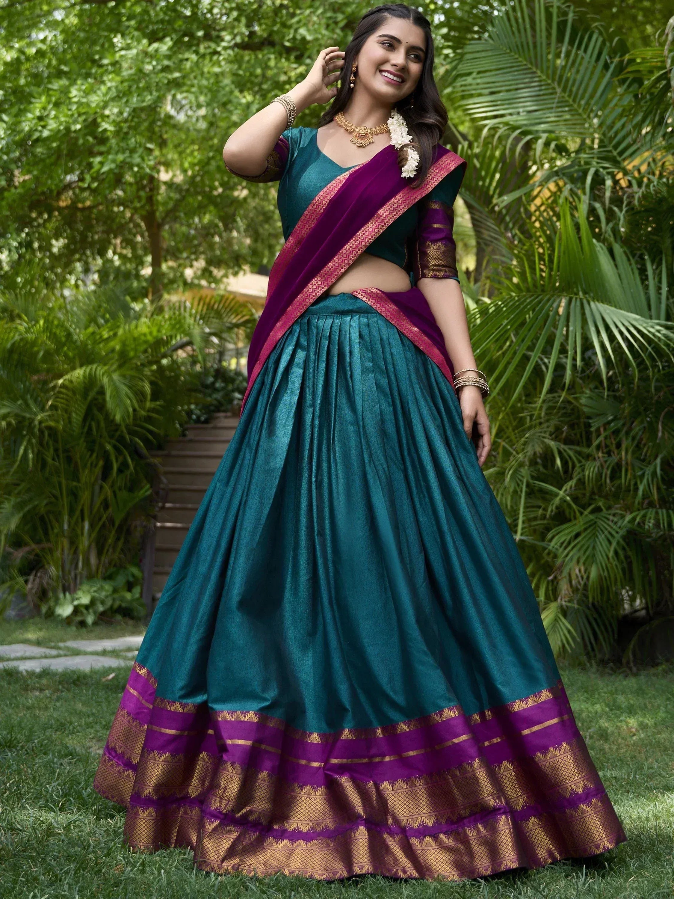 Teal and purple designer lehenga choli with gold border, perfect for Indian ethnic wear occasions