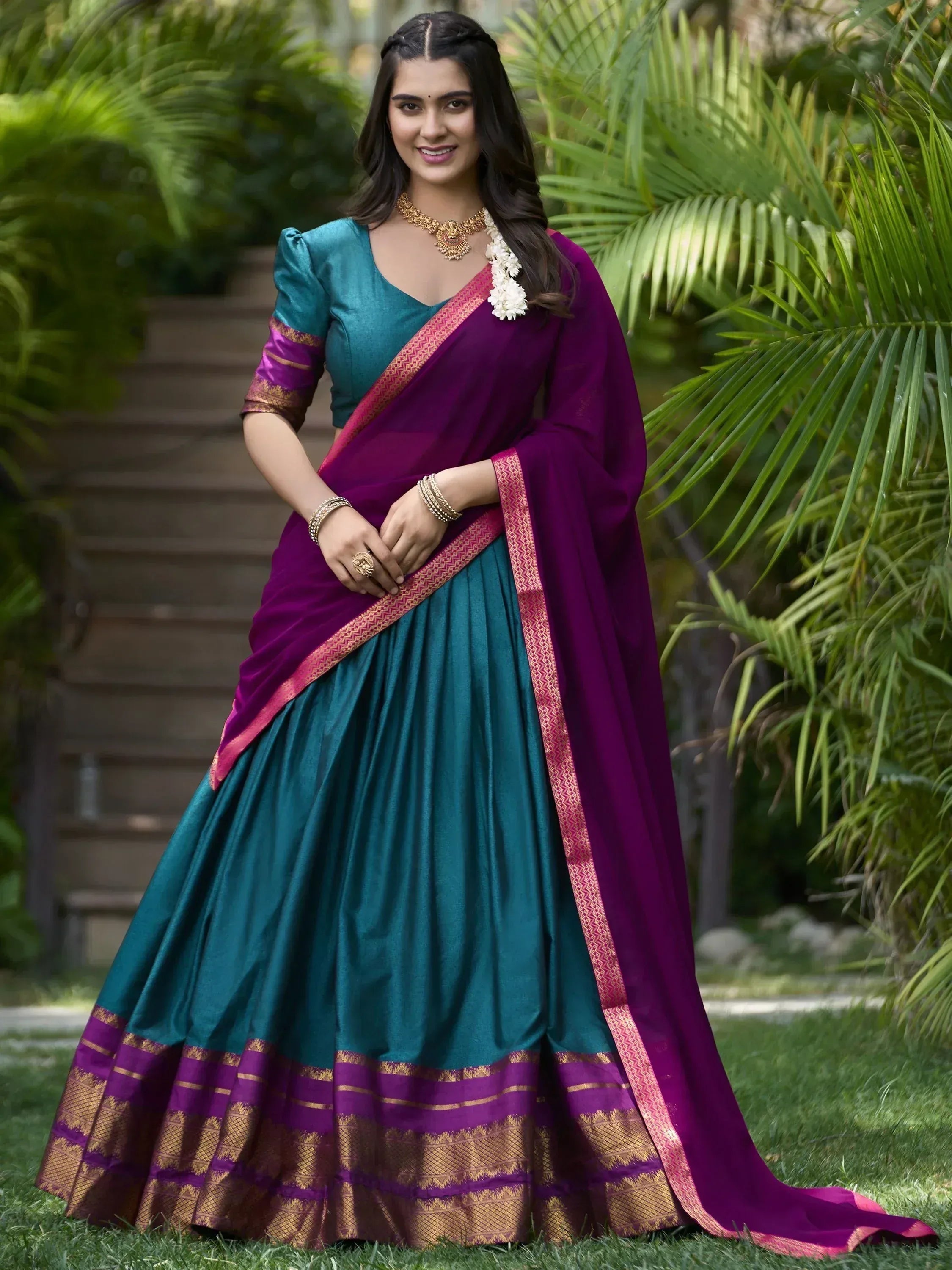 Teal and purple designer lehenga choli with gold border, perfect for Indian ethnic wear occasions