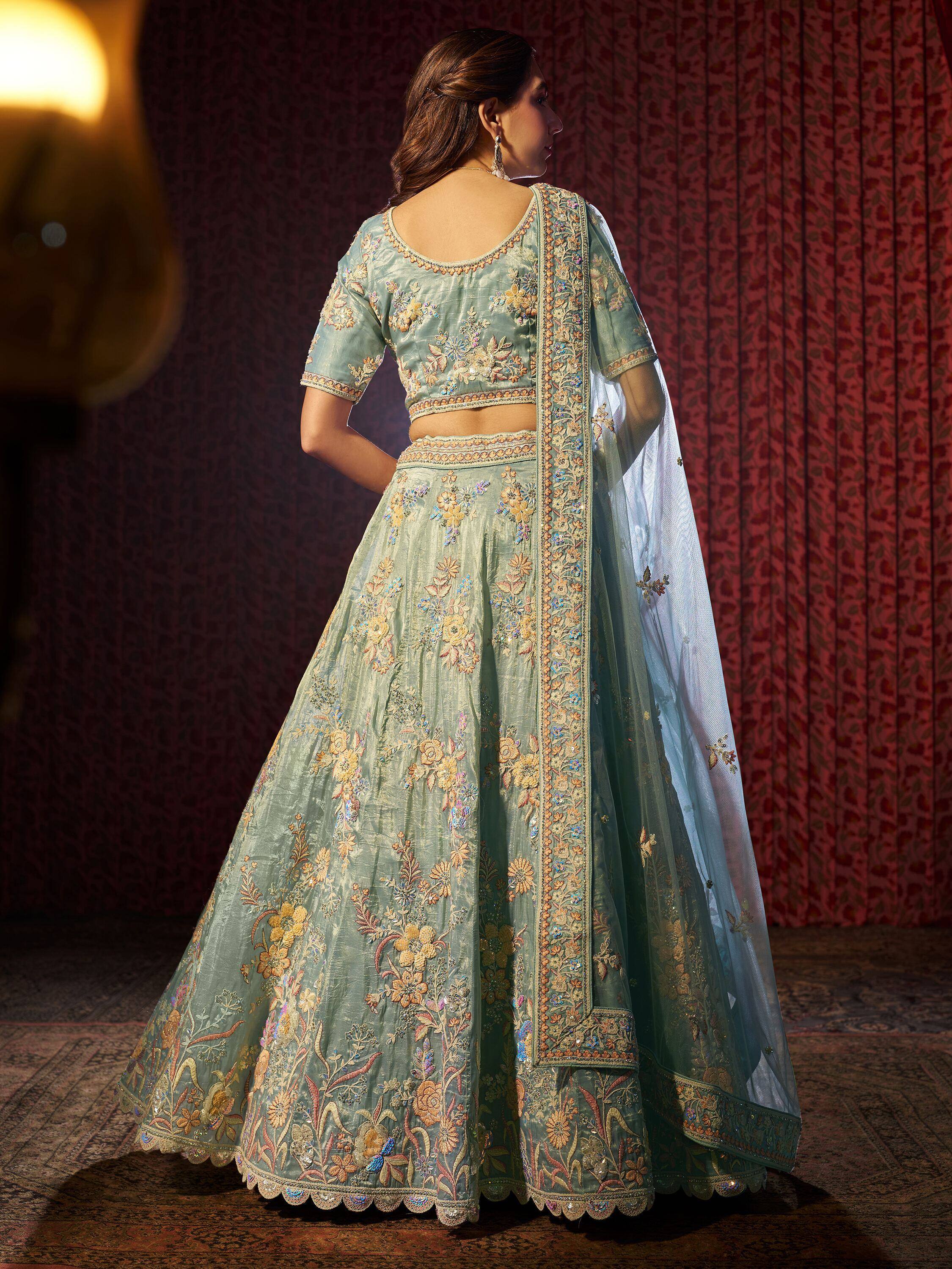 Mint green embroidered lehenga choli with floral motifs and sheer dupatta, Indian ethnic wear