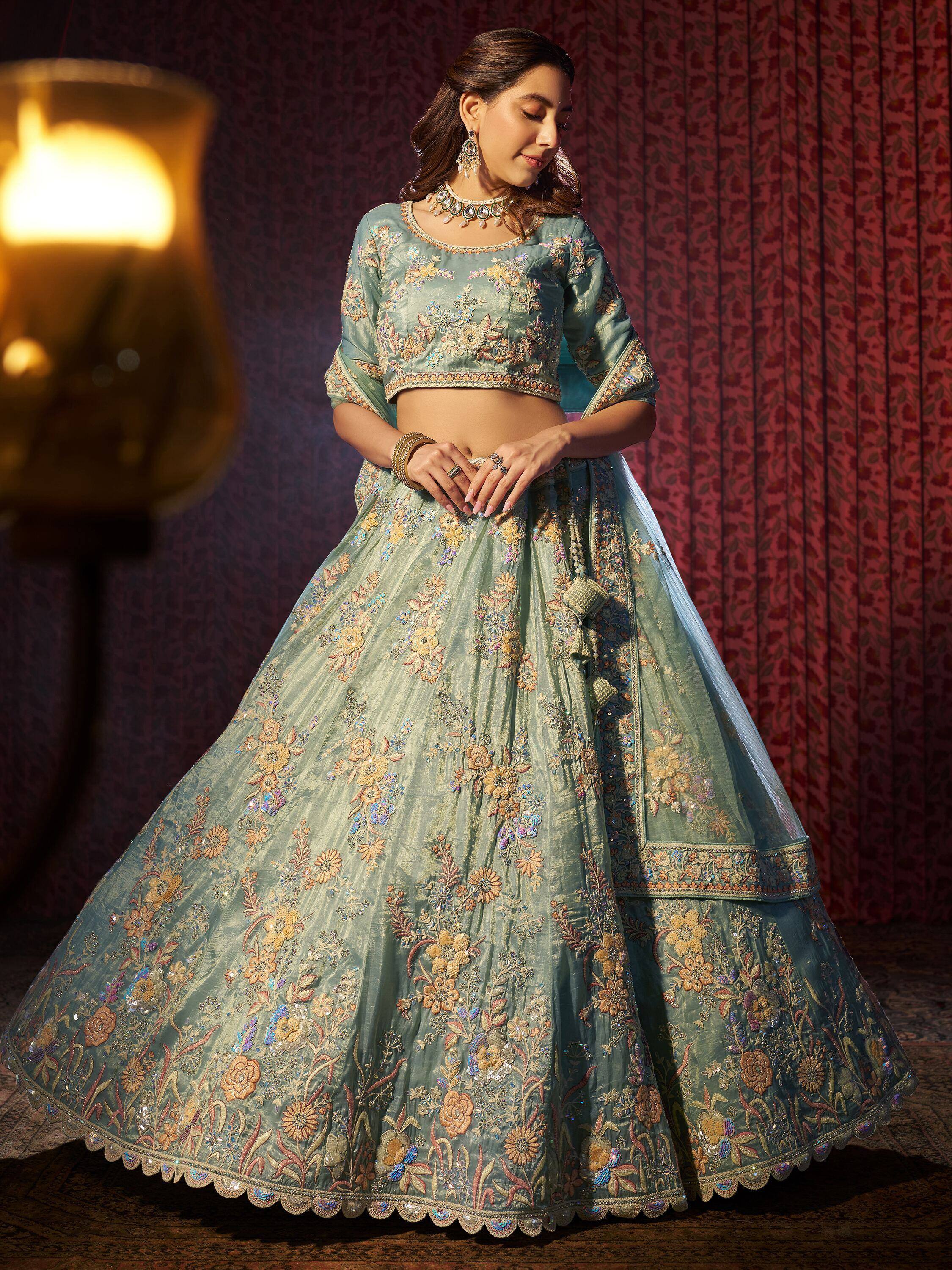 Elegant mint green lehenga choli with floral embroidery, perfect for Indian weddings and festive occasions.