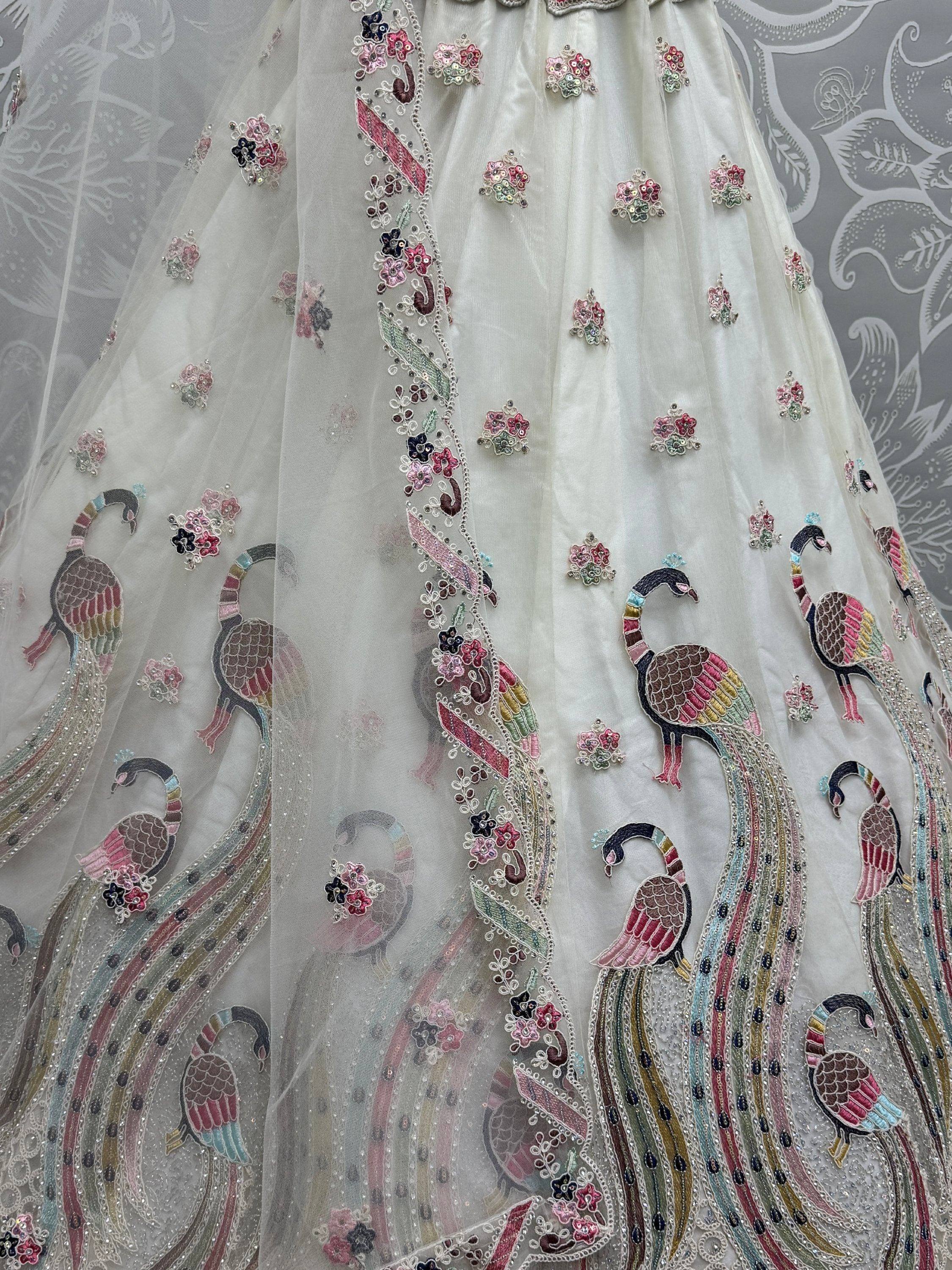 White lehenga with peacock and floral embroidery, sequin details, Indian ethnic wear
