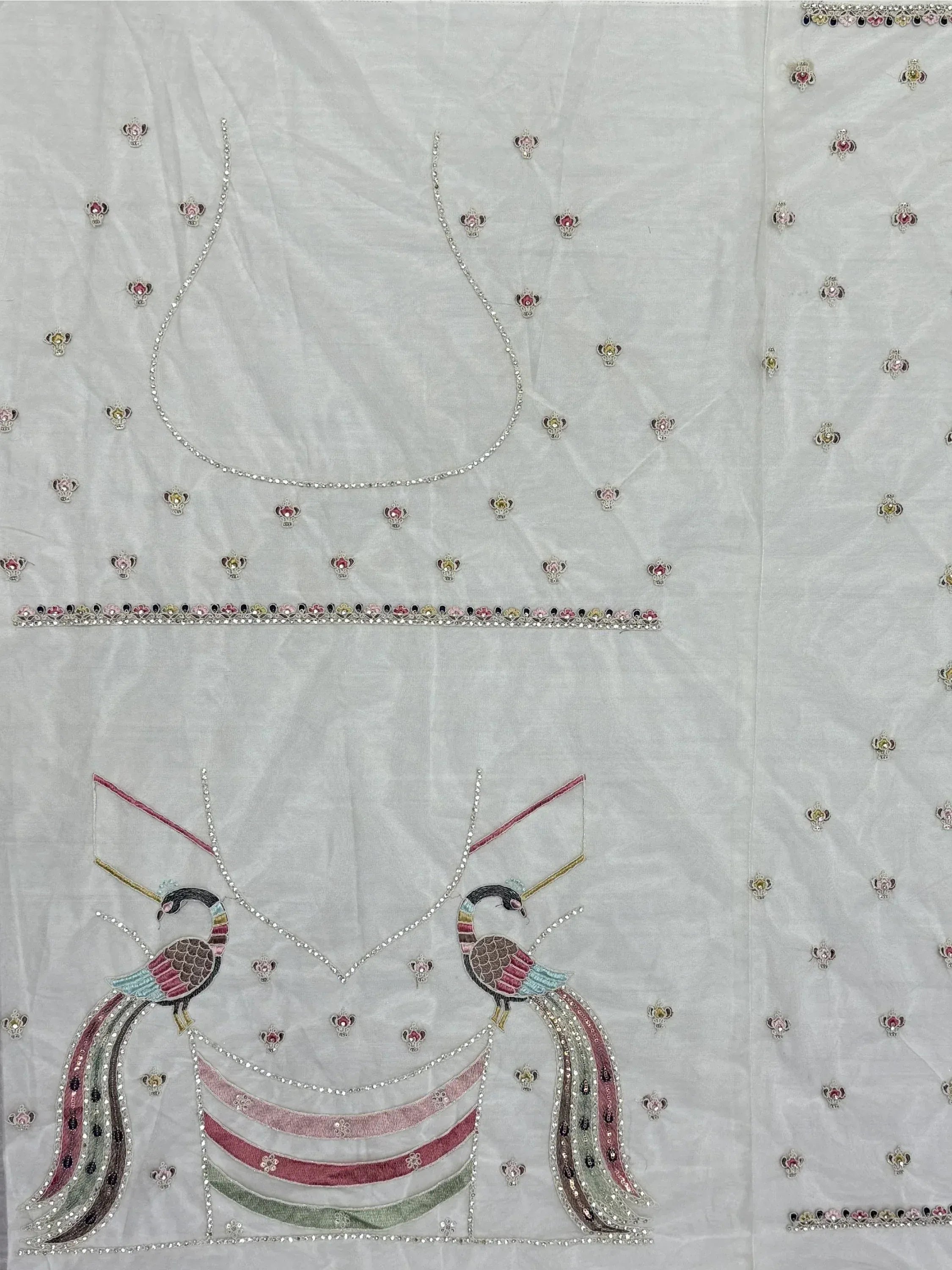 White ethnic gown with peacock embroidery and crystal embellishments for Indian occasions