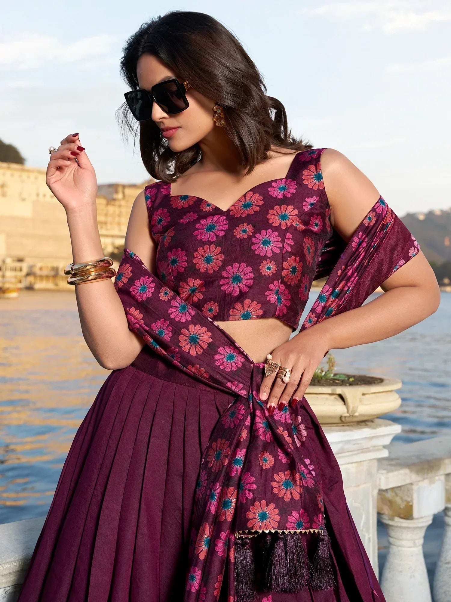 Purple floral printed lehenga choli with cold shoulder top and tassels, perfect for Indian ethnic wear
