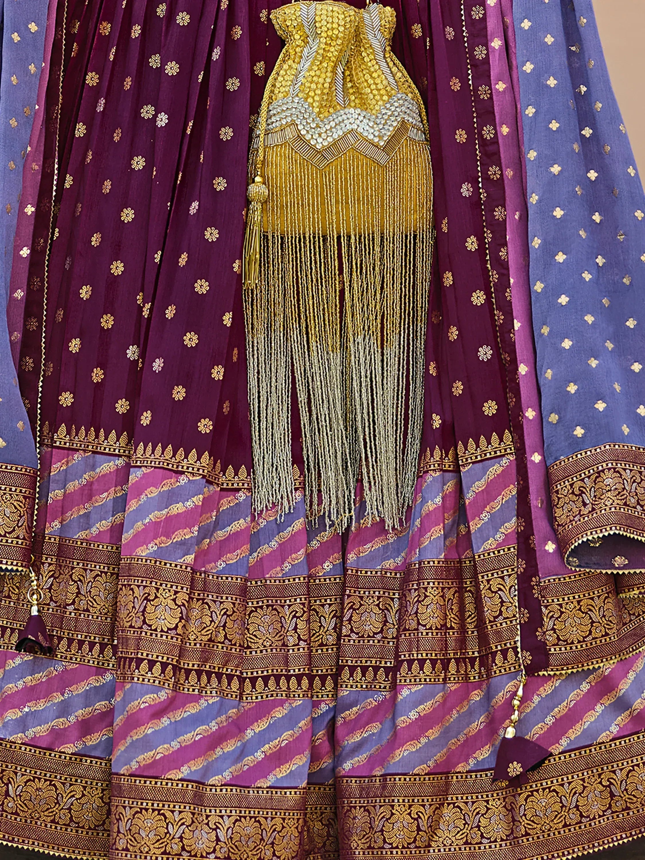 Purple and blue designer lehenga choli with gold embroidery and tassels, ethnic Indian wear