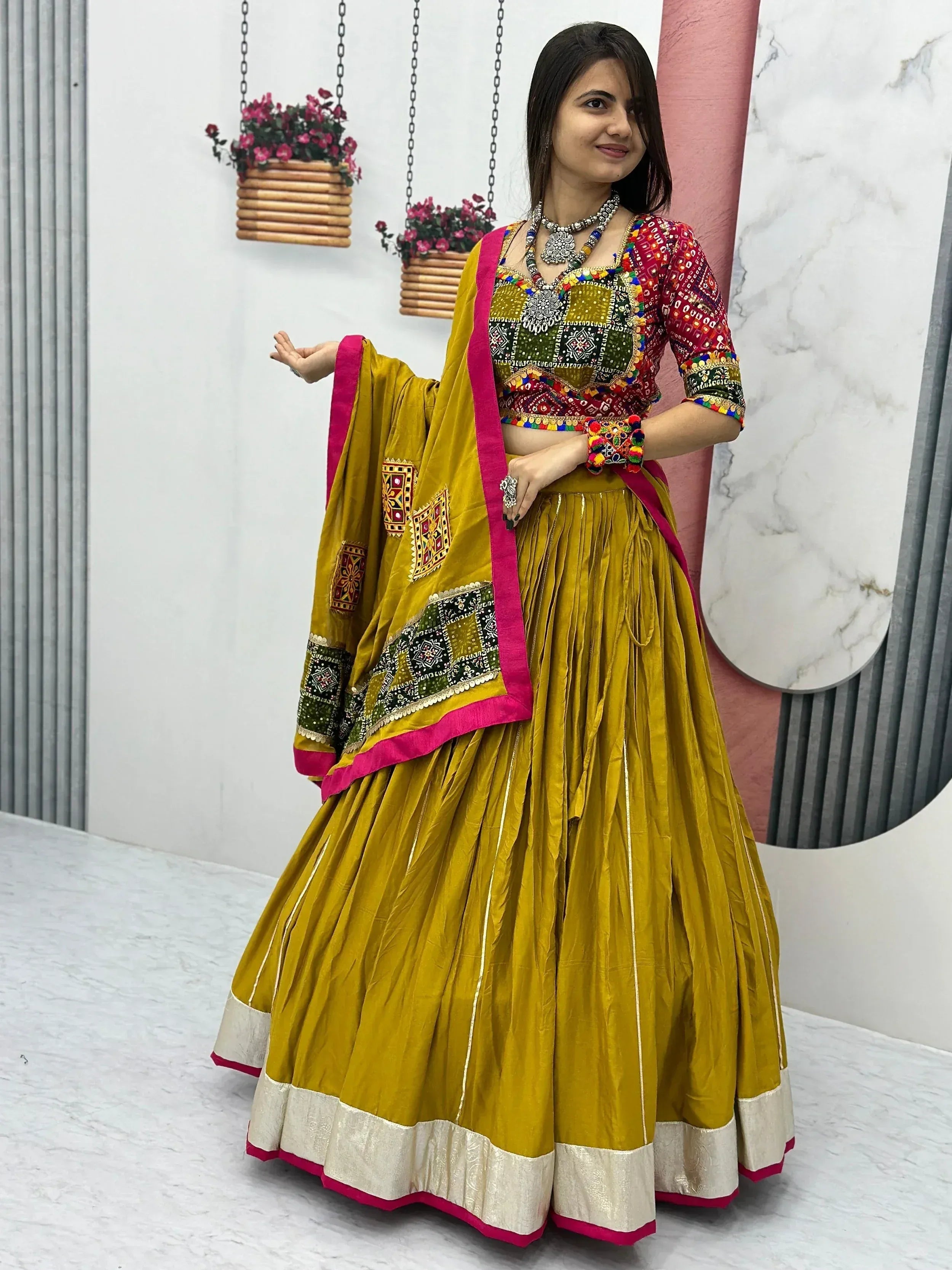Mustard yellow embroidered lehenga choli with mirror work, perfect for Indian ethnic wear events
