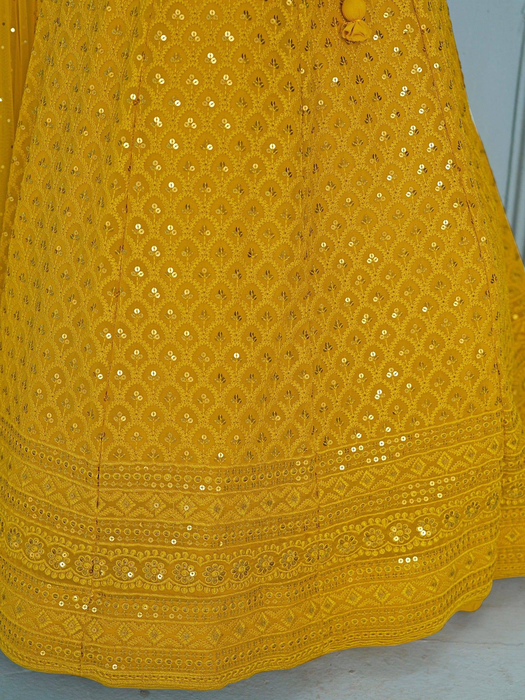 Mustard yellow ethnic gown with gold sequin embroidery and floral border design