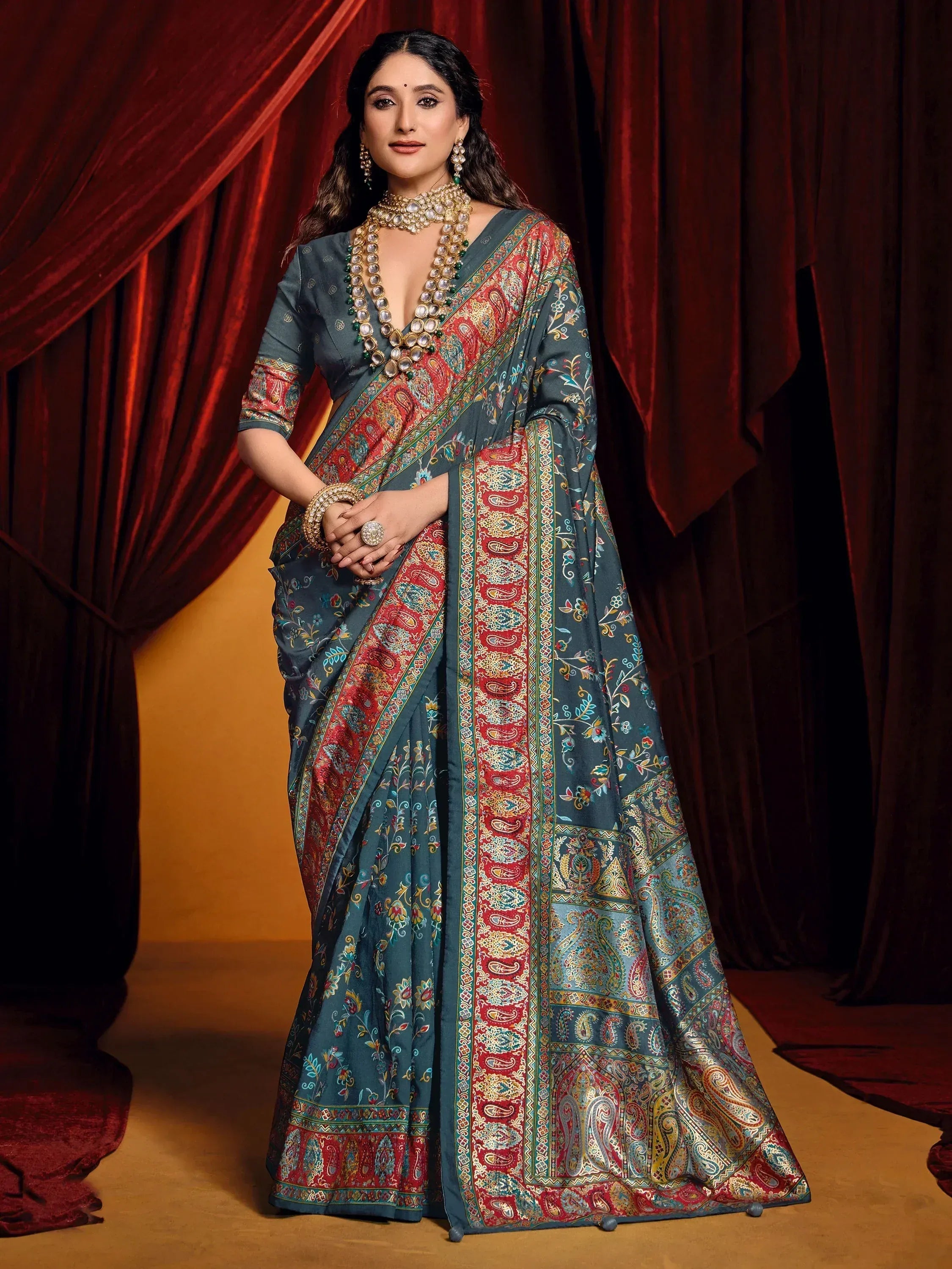 Elegant teal saree with red paisley print, perfect for Indian ethnic wear occasions