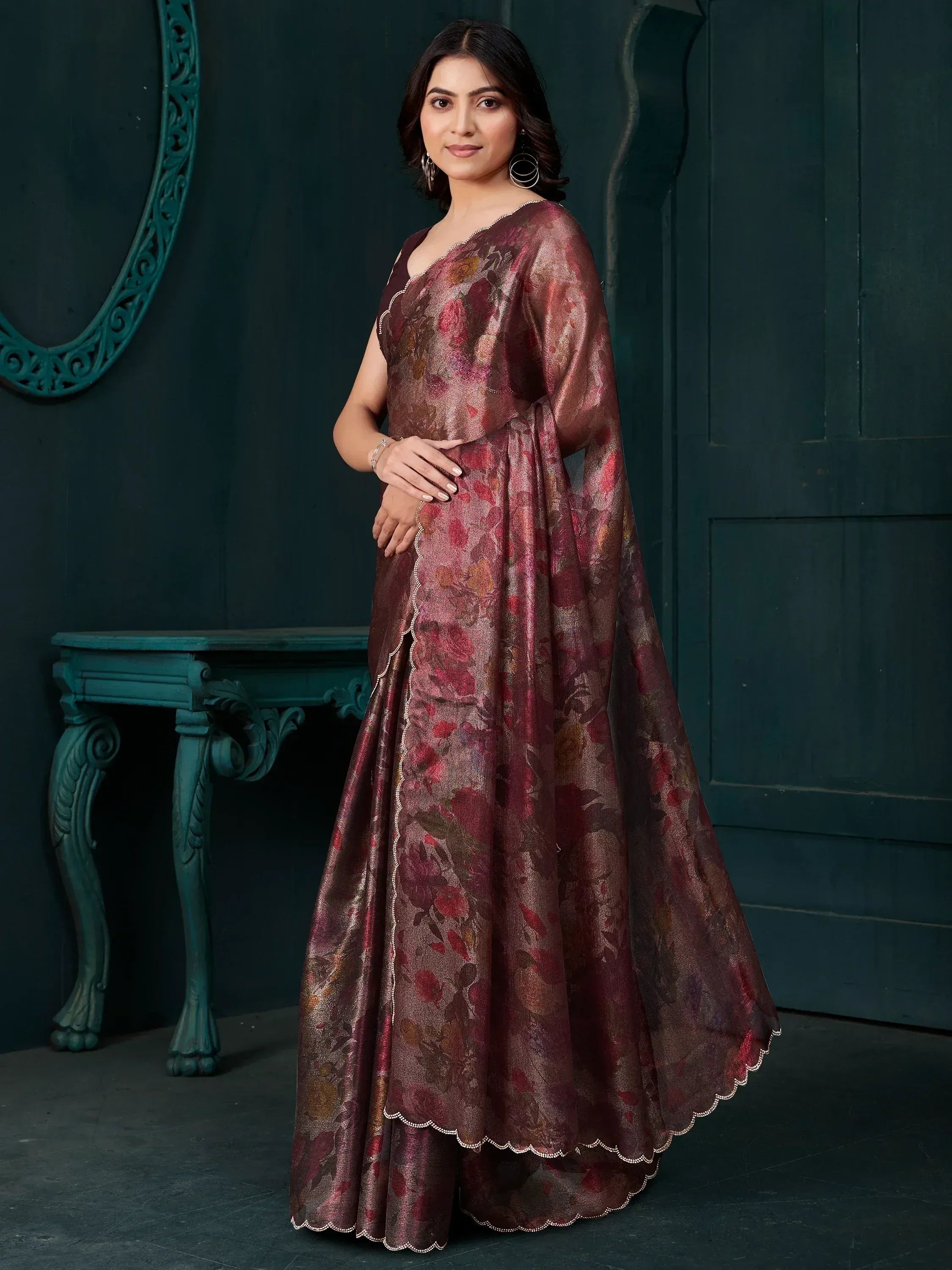 Elegant maroon floral ethnic gown with scalloped hem, perfect for Indian occasions and festive wear.