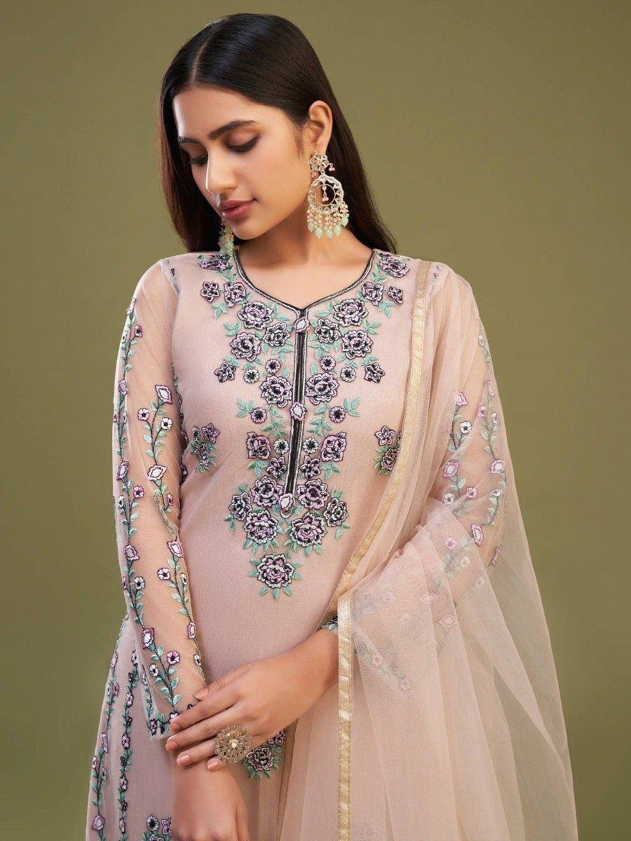 Elegant blush pink embroidered salwar kameez with floral motifs and sheer dupatta, perfect for ethnic occasions.