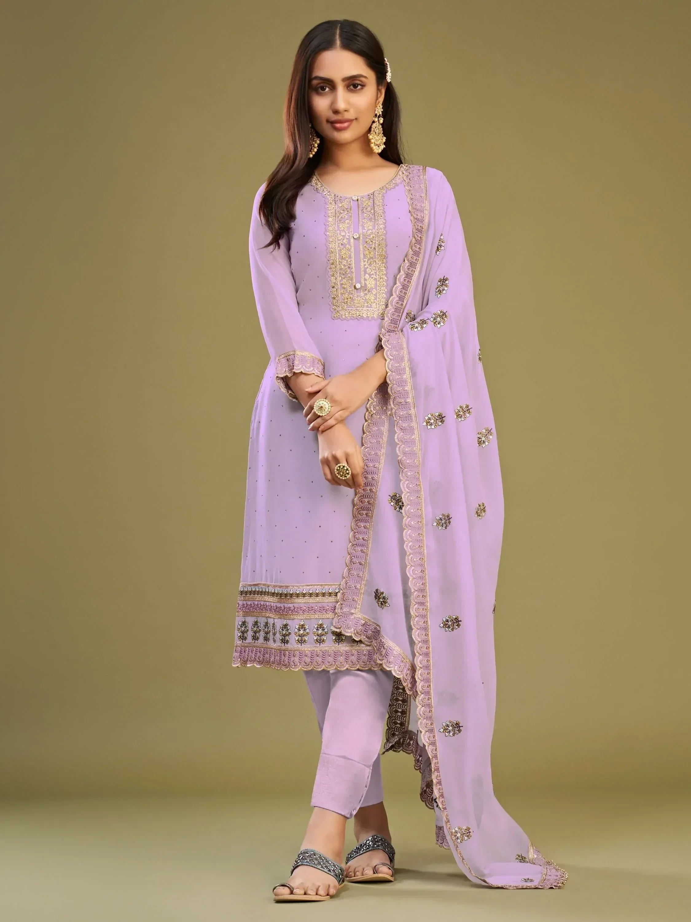 Lavender embroidered salwar kameez with gold detailing, perfect for Indian ethnic wear occasions.