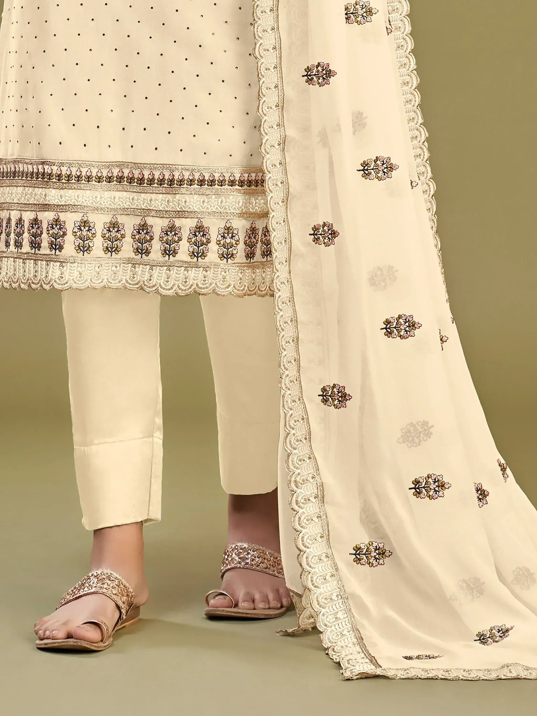 Cream embroidered salwar kameez with floral dupatta and embellished sandals