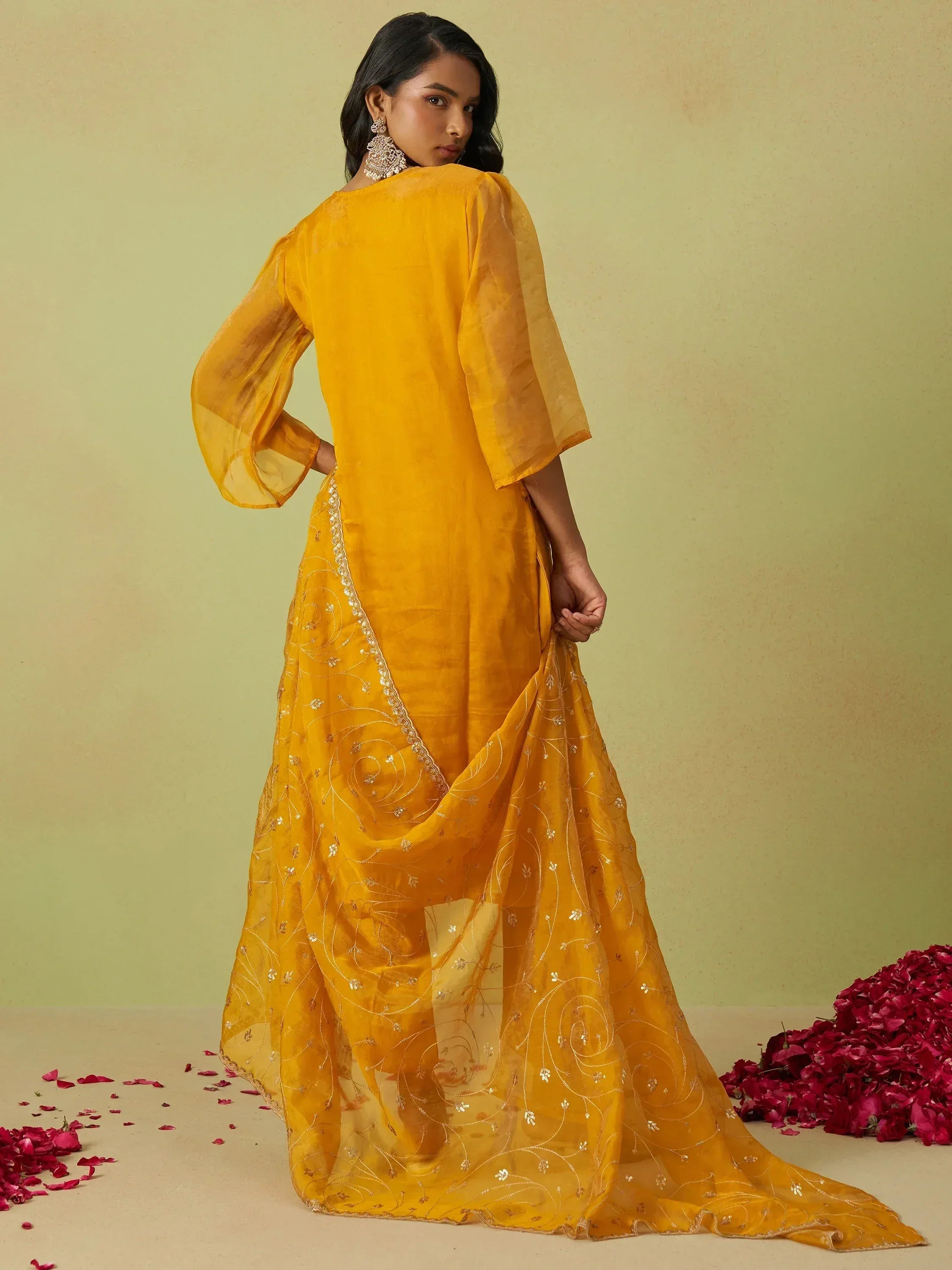 Yellow ethnic gown with sheer sleeves and gold embroidery, perfect for Indian festive occasions