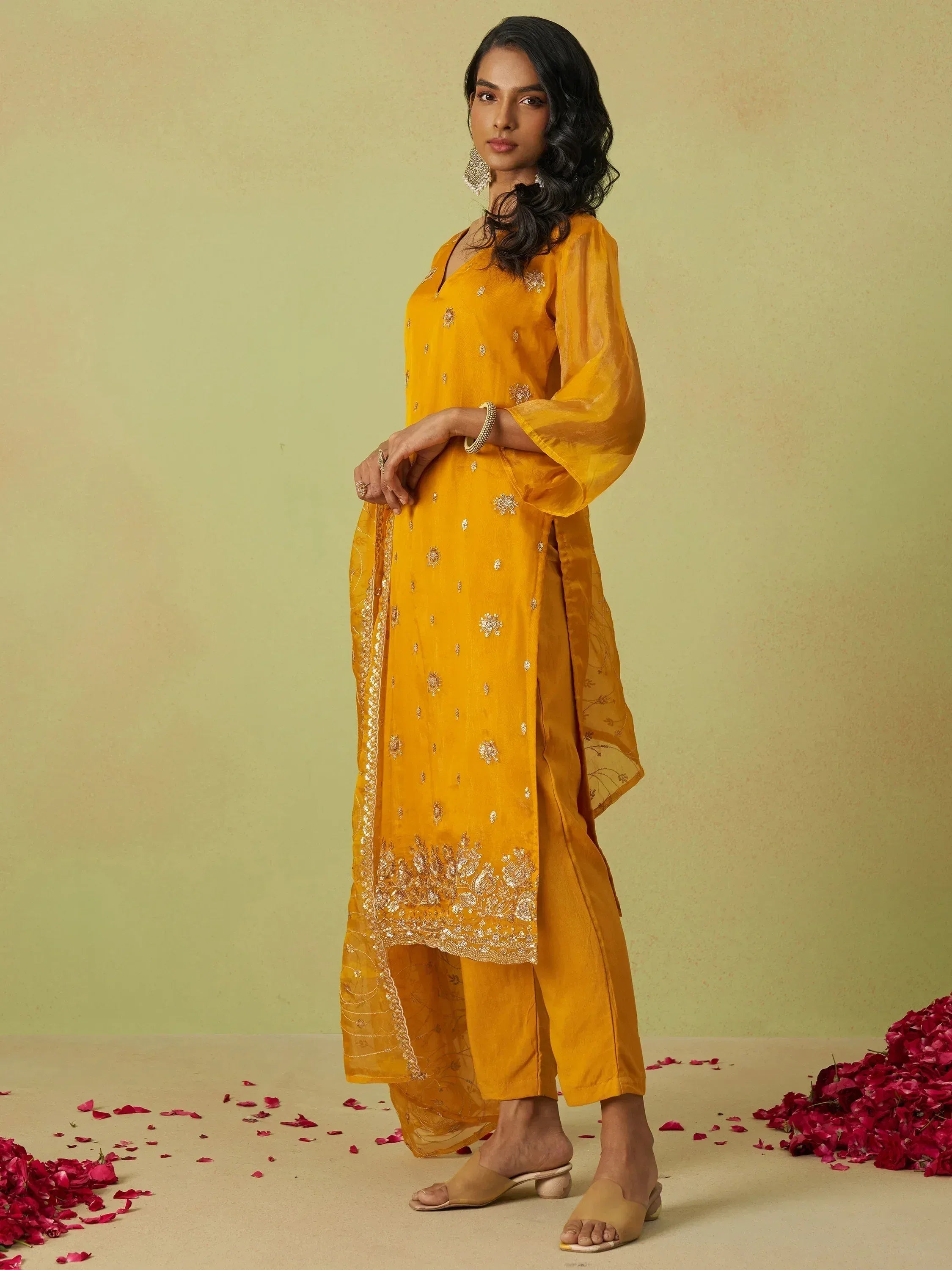 Yellow embroidered salwar kameez with floral details, perfect for ethnic occasions